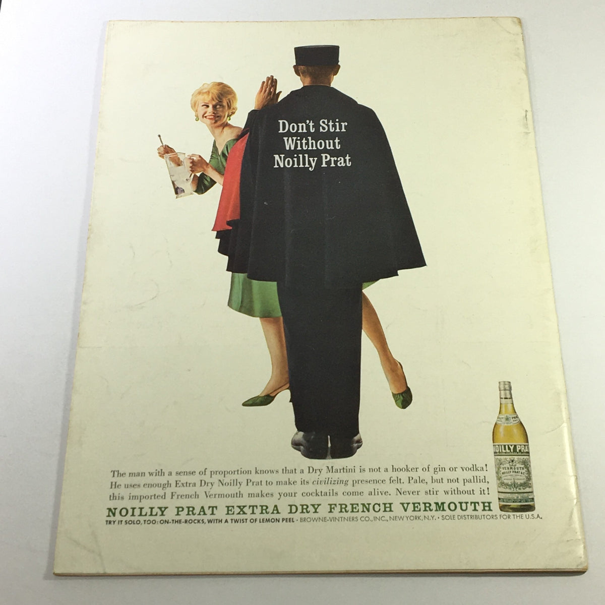 Back cover of VTG Gourmet The Magazine of Good Living January 1962, showcasing an advertisement for Noilly Prat Extra Dry French Vermouth with a stylish couple celebrating cocktails.
