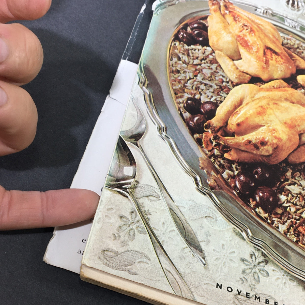 Close-up of the cover of VTG Gourmet The Magazine of Good Living November 1963, showcasing roasted chickens and a silver serving spoon.
