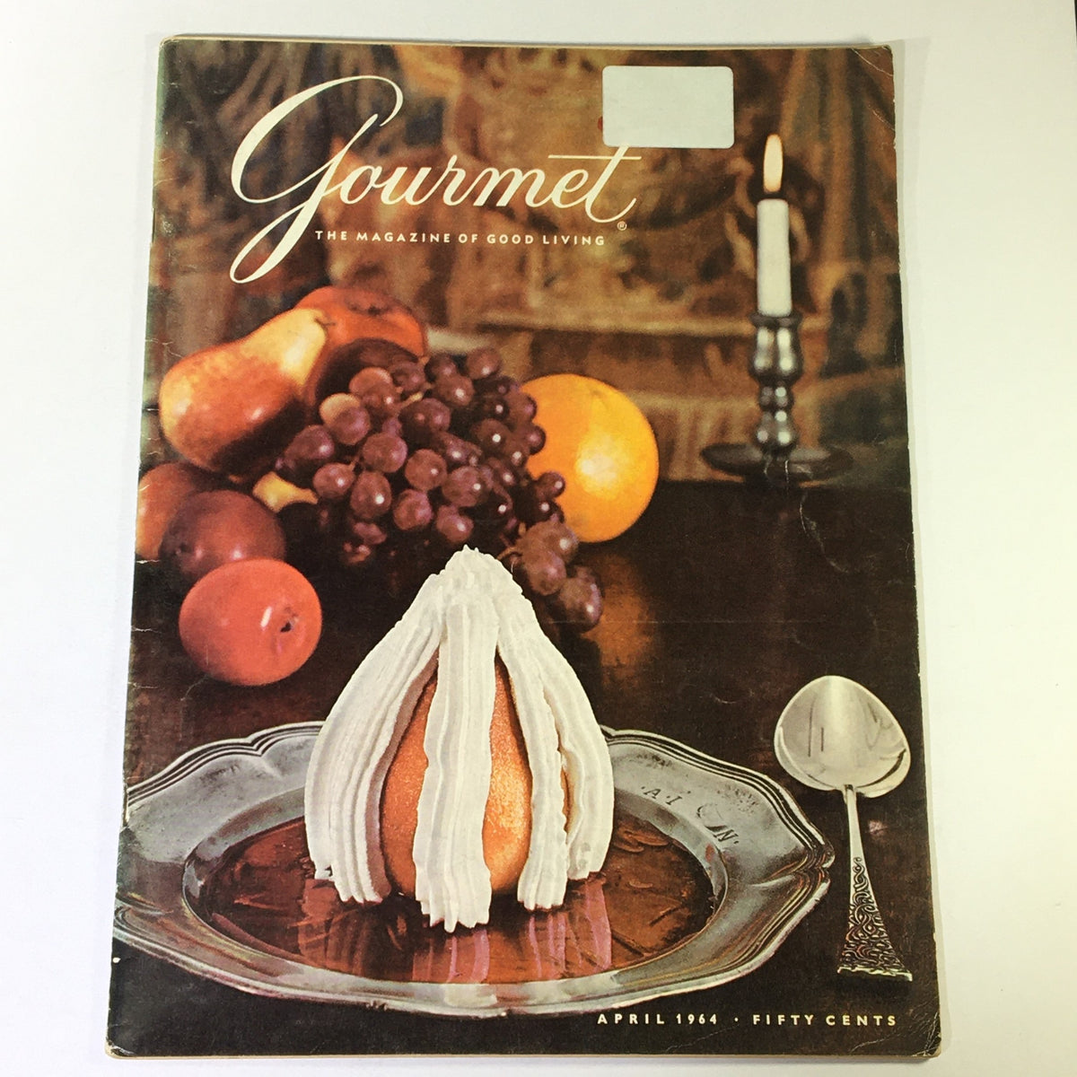 Cover of VTG Gourmet: The Magazine of Good Living April 1964 featuring a dessert presentation with fruits on a dinner table.