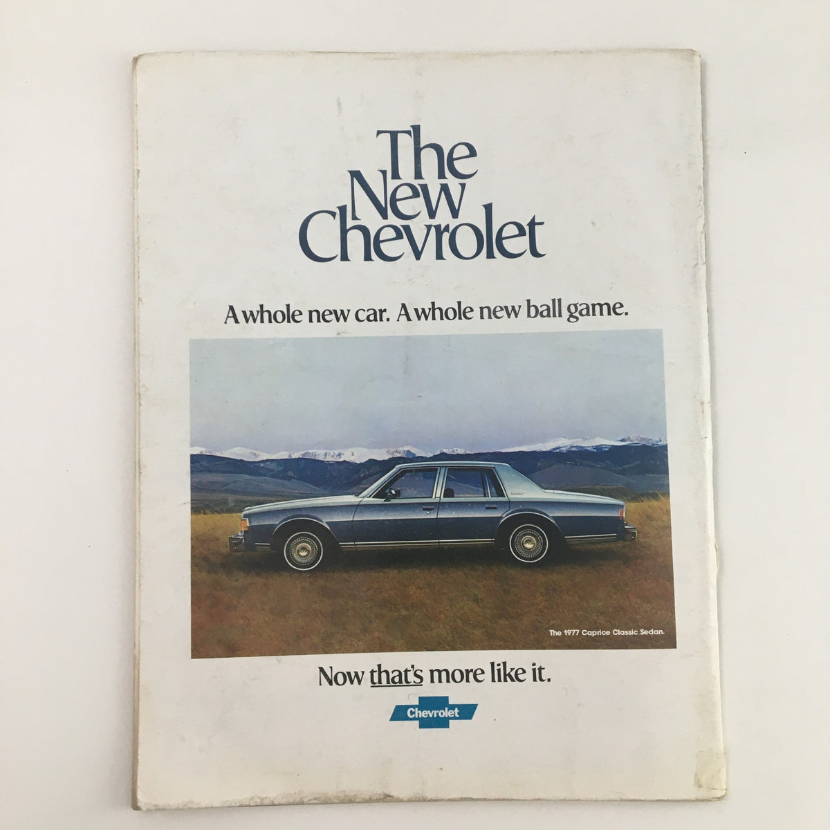 1976 Navy Boston College Navy-Marine Corps Memorial Stadium Program featuring a vintage advertisement for a new Chevrolet car in a scenic outdoor setting.