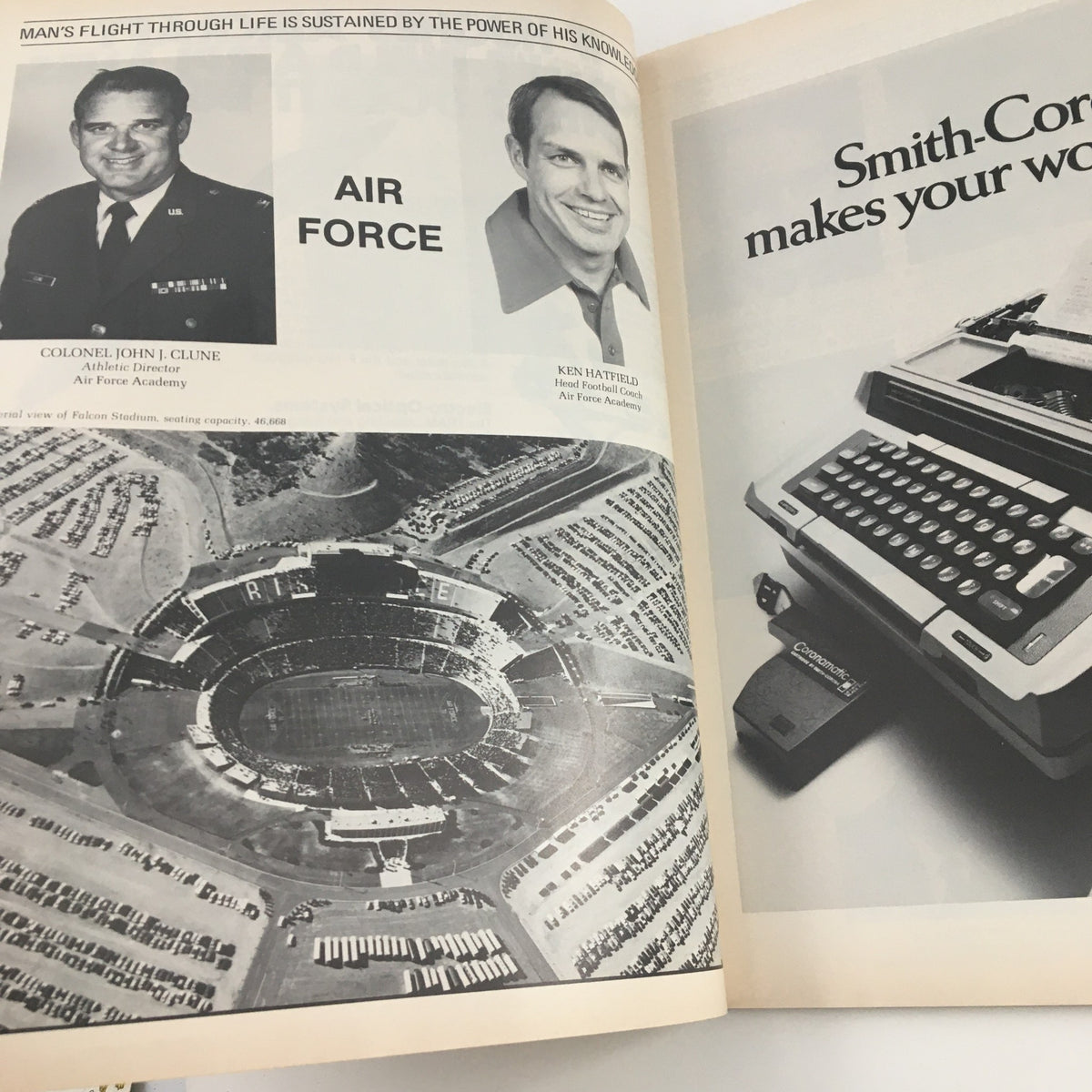Photo of Colonel John J. Clune and Head Football Coach Ken Hatfield with aerial view of Falcon Stadium, featured in the 1981 Navy Air Force Navy-Marine Corps Memorial Stadium Official Program.