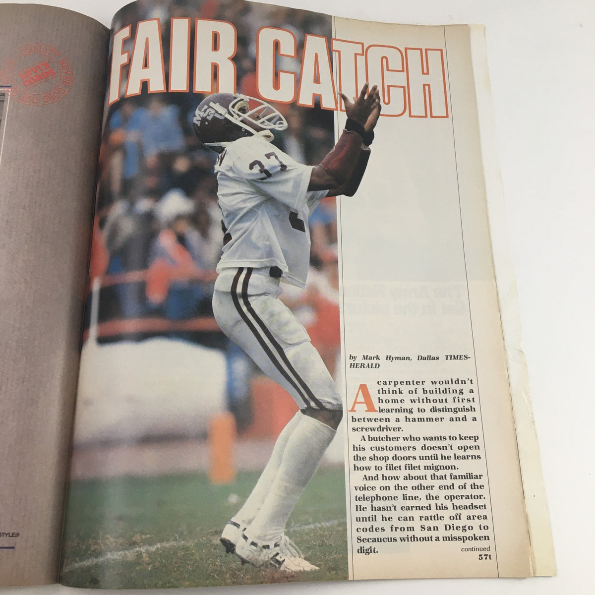 1982 Navy-Marine Corps Memorial Stadium Navy vs Virginia Program depicting a player making a fair catch during a football game, showcasing the game's action.