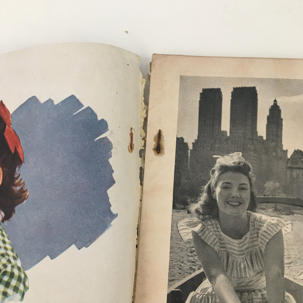 Inside page of Woman's Day Magazine September 1946 featuring a vintage photograph of a woman in a boat, representing the era's fashion.