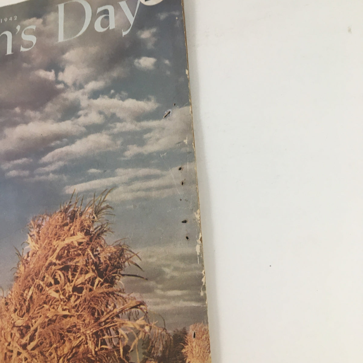 Close-up view of the cover of Woman's Day Magazine November 1942 showcasing the title and autumn agricultural imagery.
