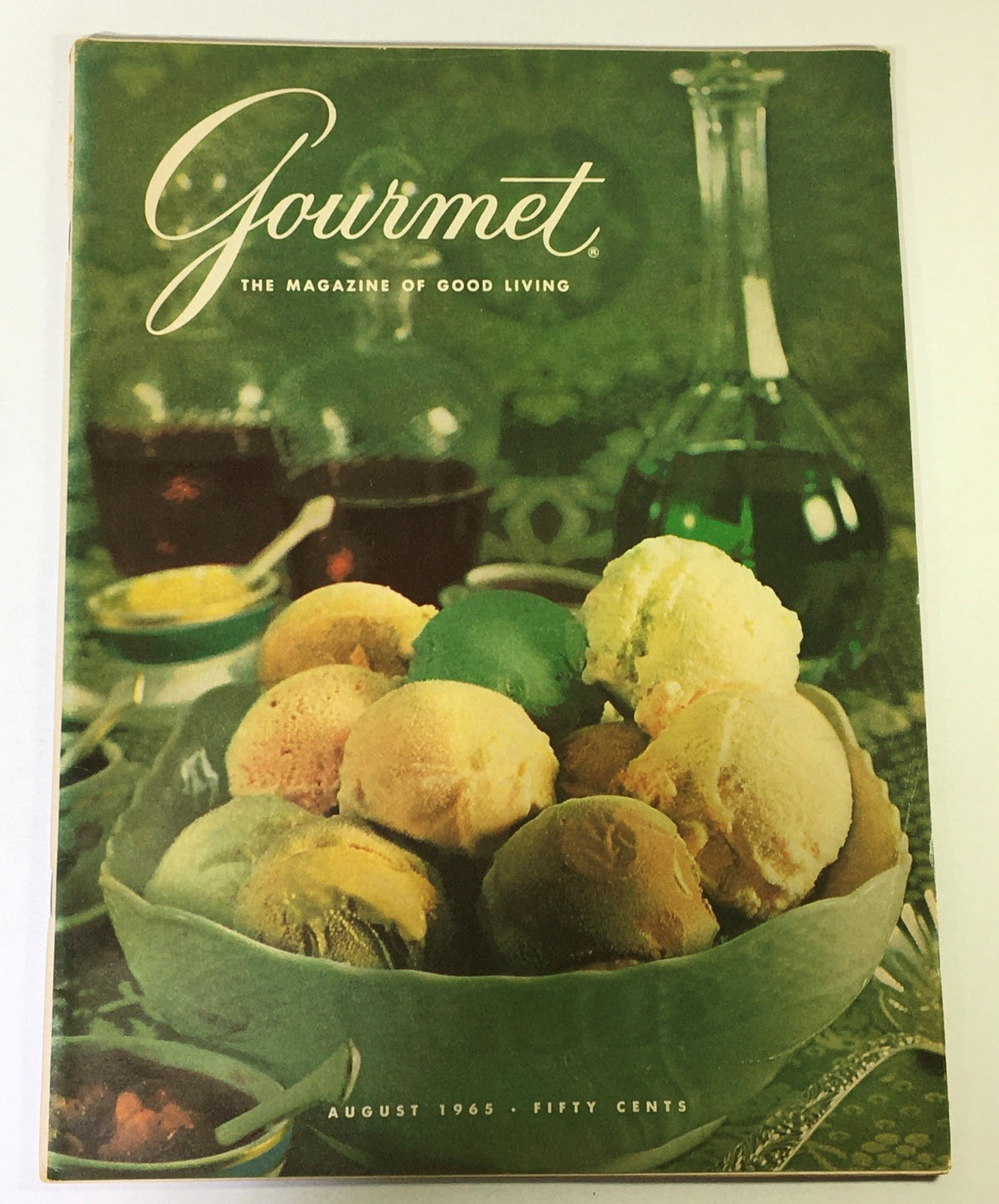 Cover of VTG Gourmet The Magazine of Good Living, August 1965, featuring a colorful assortment of ice cream scoops in a decorative bowl, symbolizing culinary nostalgia.