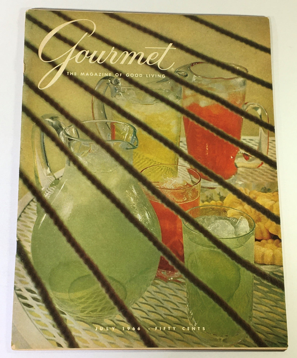 Vintage Gourmet Magazine cover from July 1966 featuring colorful drinks and the title 'Gourmet: The Magazine of Good Living' - perfect for collectors and vintage magazine enthusiasts.