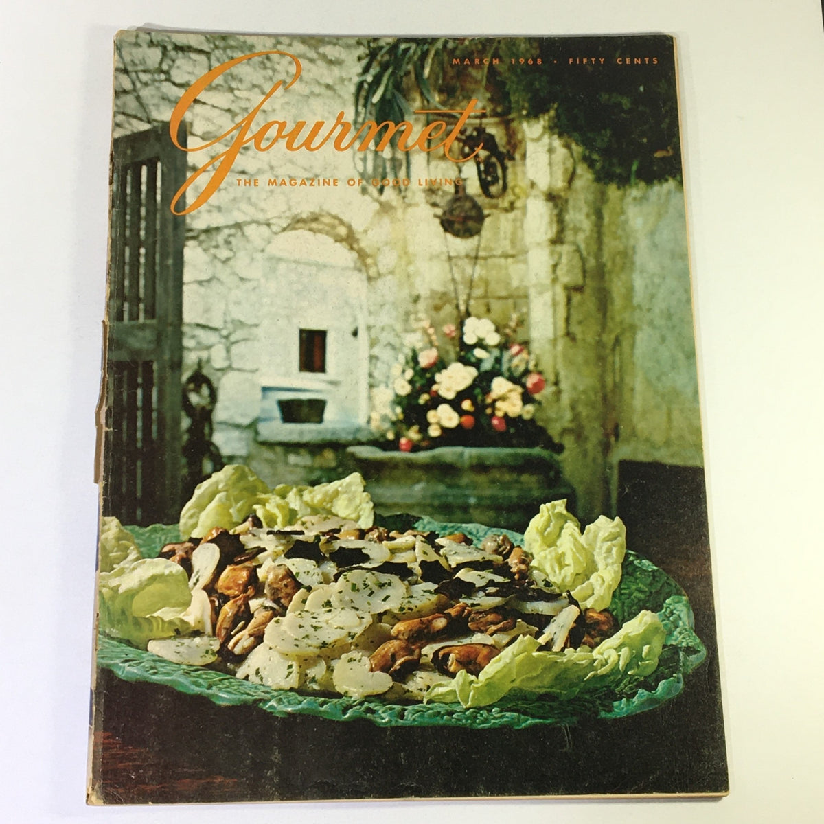 Cover of VTG Gourmet Magazine, March 1968 issue titled 'Corsica: Isle of Contrasts', featuring a vibrant dish with vegetables on a decorative plate, set against a rustic background with flowers.
