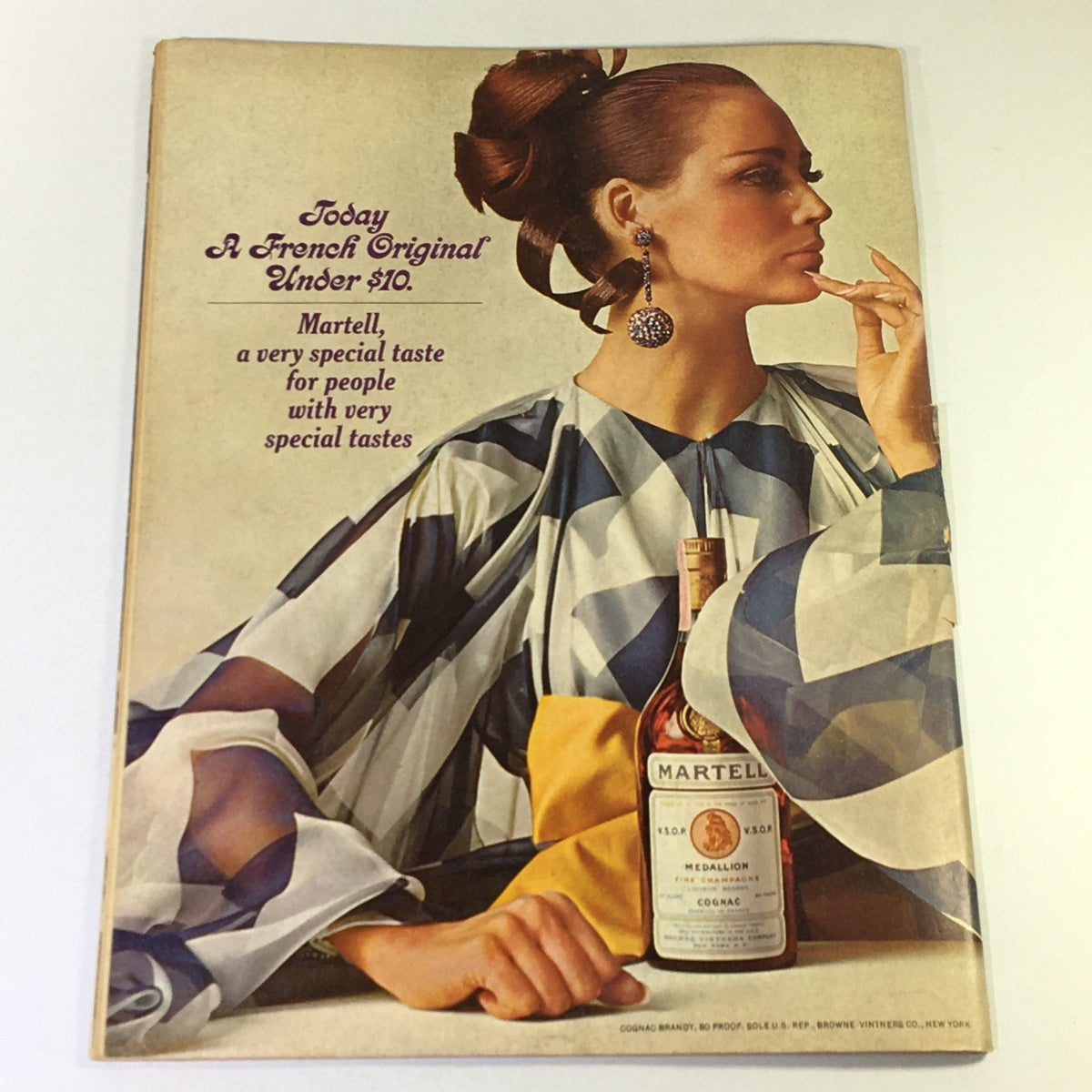 Vintage advertisement featuring a stylish woman promoting Martell Cognac, as seen in the March 1968 issue of VTG Gourmet Magazine titled 'Corsica: Isle of Contrasts'.
