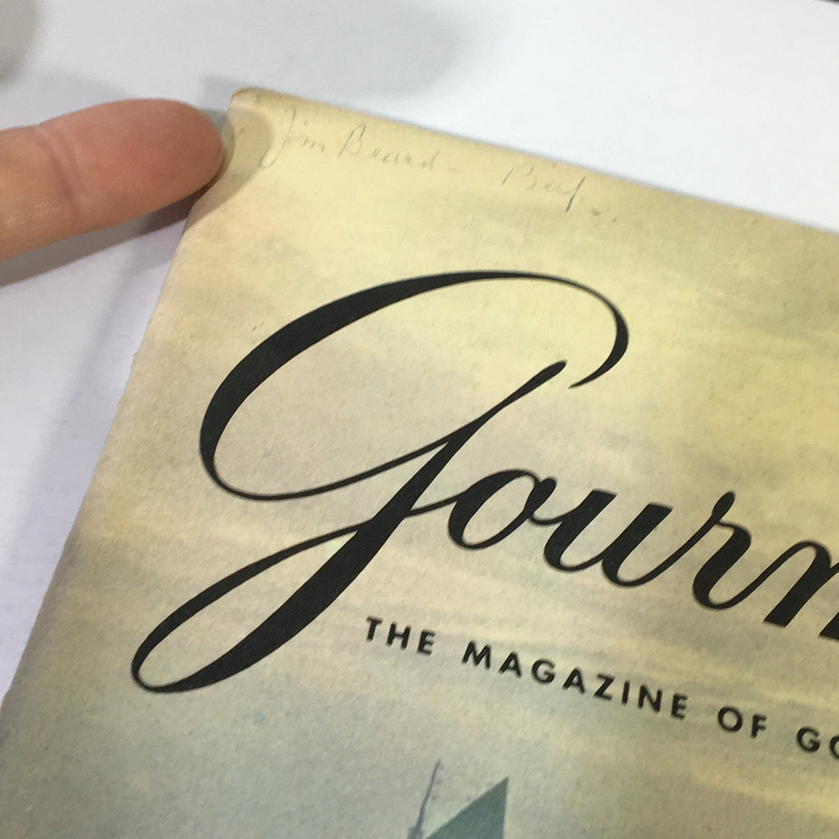 Close-up of the top corner of VTG Gourmet The Magazine of Good Living March 1969, showing handwritten note with 'Jim Beard - Beef' alongside the magazine's title.