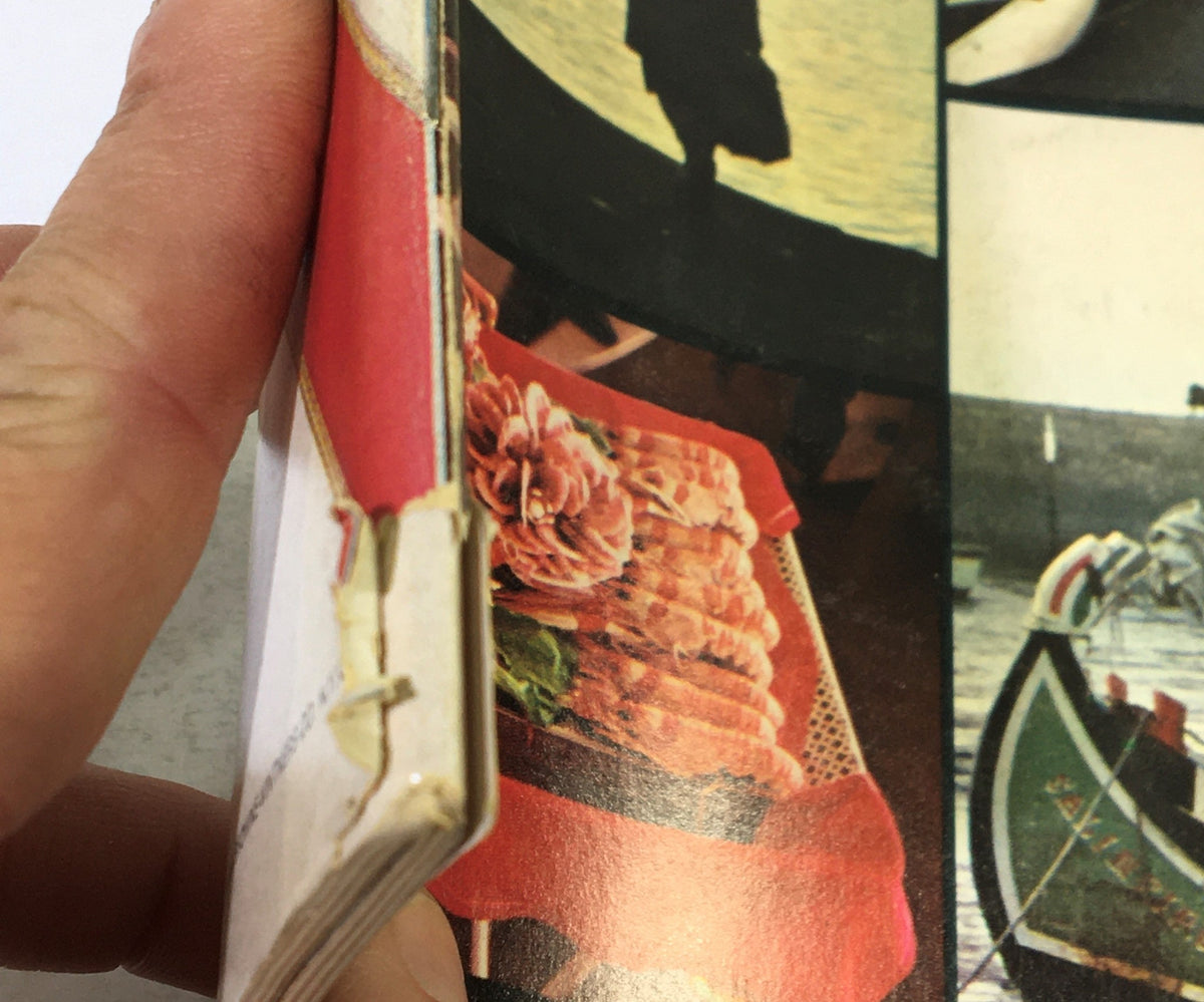 Close-up of the spine of VTG Gourmet The Magazine of Good Living, March 1969, showing minor wear and the vintage aesthetic of this collectible magazine.