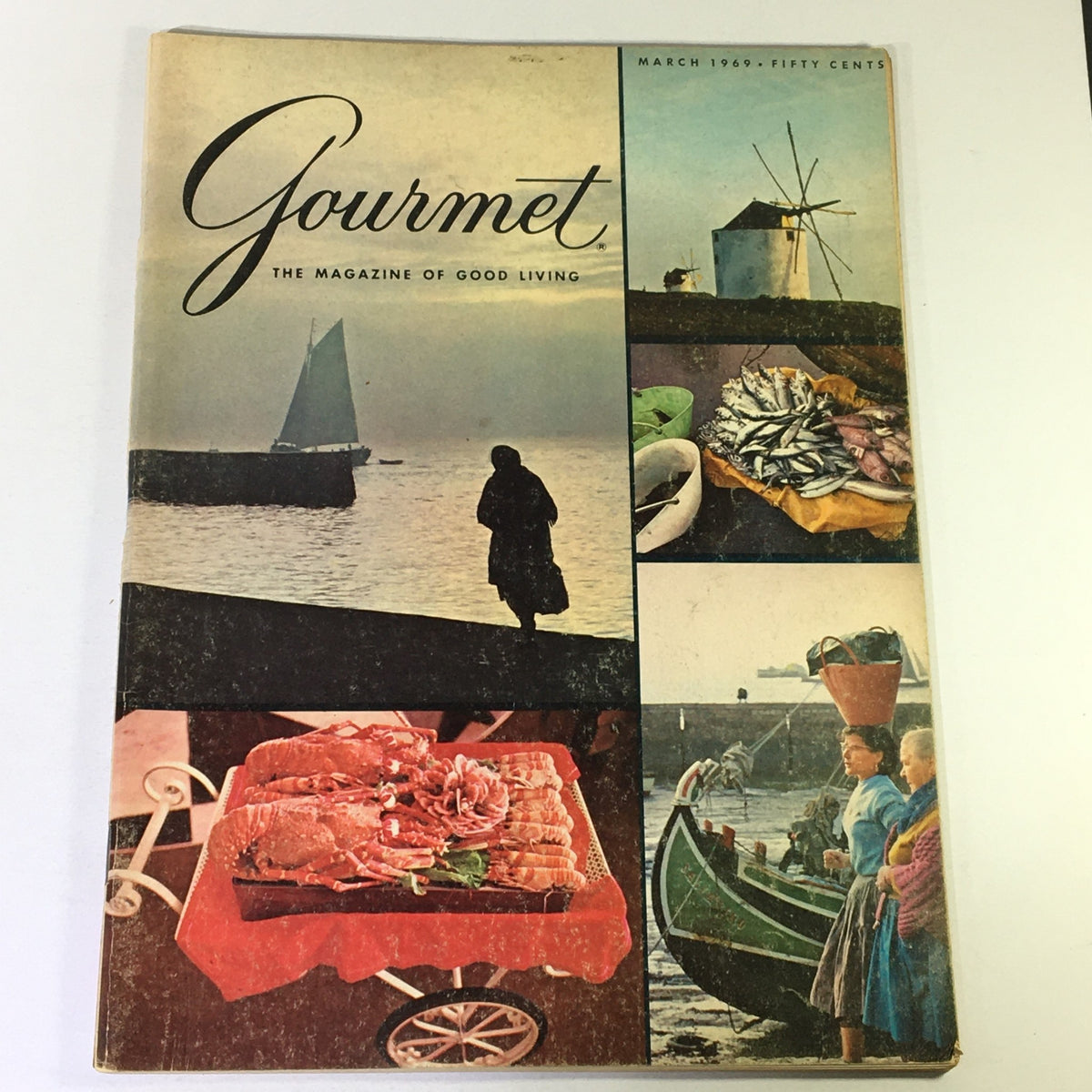 Cover of VTG Gourmet The Magazine of Good Living March 1969 featuring images of a sailboat, coastal scenery, seafood displayed on a cart, and local fishermen, encapsulating culinary culture and lifestyle of the era.