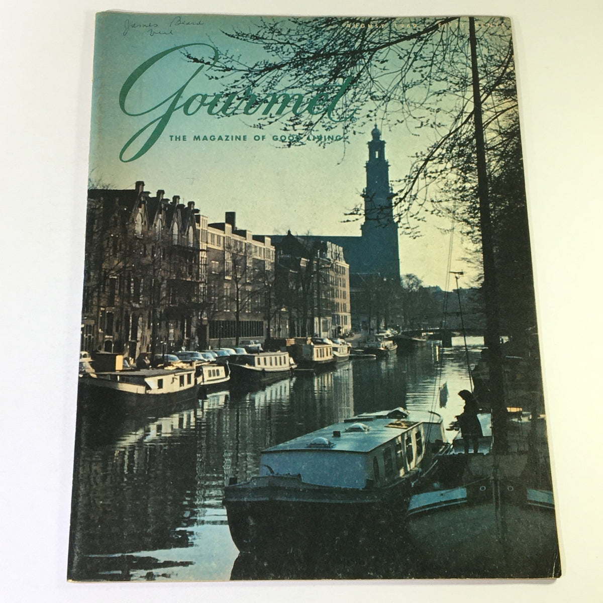 Cover of VTG Gourmet: The Magazine of Good Living August 1969 featuring a scenic canal view, boats docked, and buildings reflecting the essence of dining culture in the late 1960s.