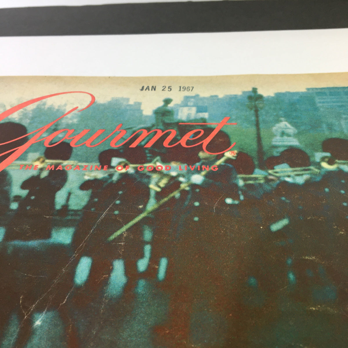 Cover of VTG Gourmet The Magazine of Good Living February 1967 featuring the title 'The Admirable Avocado', showcasing the vintage aesthetic with a blue-hued background and traditional imagery.