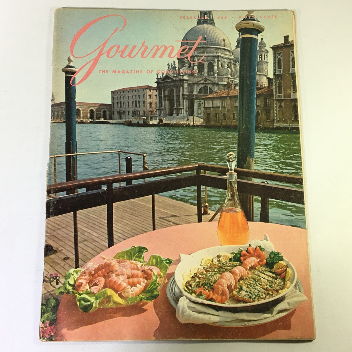 Cover of VTG Gourmet Magazine - February 1969 featuring a picturesque view with a seafood dish, reflecting 1960s culinary culture.