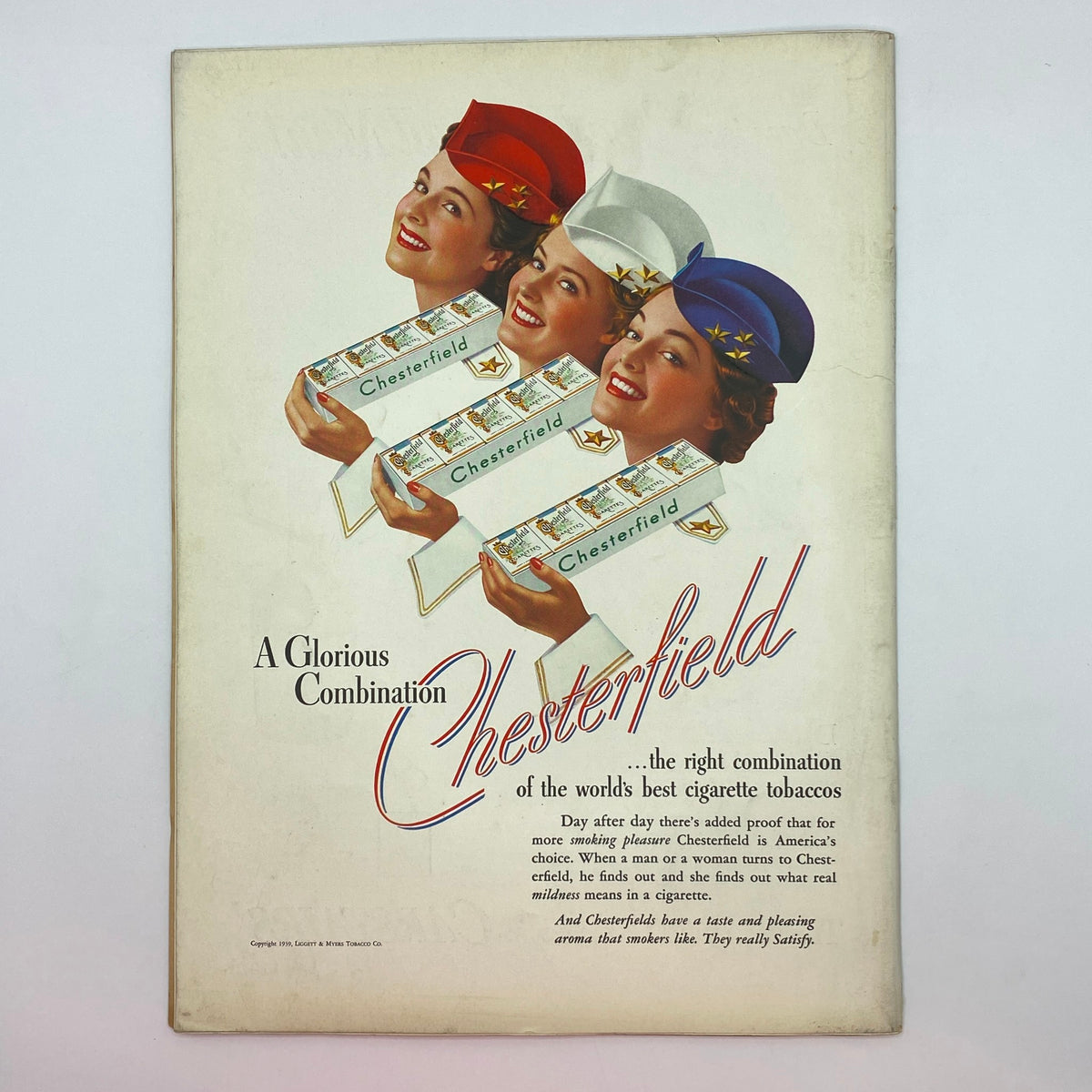 Vintage advertisement for Chesterfield cigarettes from The New Yorker magazine, featuring smiling women in hats representing the brand.