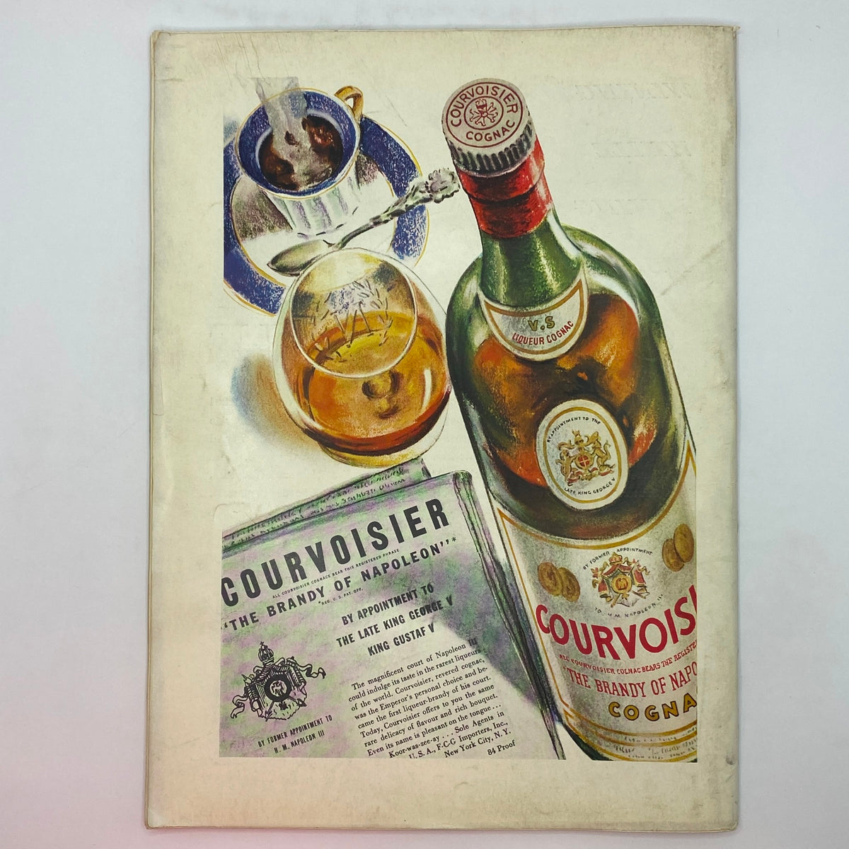Illustrative advertisement from The New Yorker magazine showcasing Courvoisier Cognac alongside a cup of coffee and a newspaper, highlighting premium spirits.