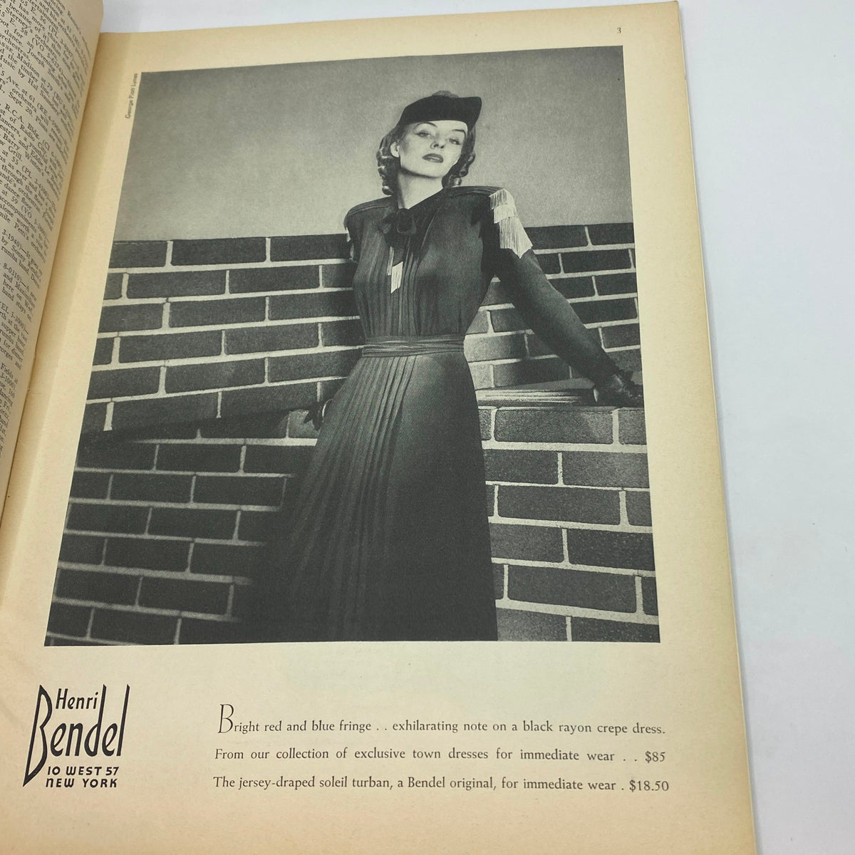 Advertisement for Henri Bendel in The New Yorker Complete Magazine September 16, 1939 featuring a model in stylish attire against a brick wall, promoting exclusive dresses and accessories.