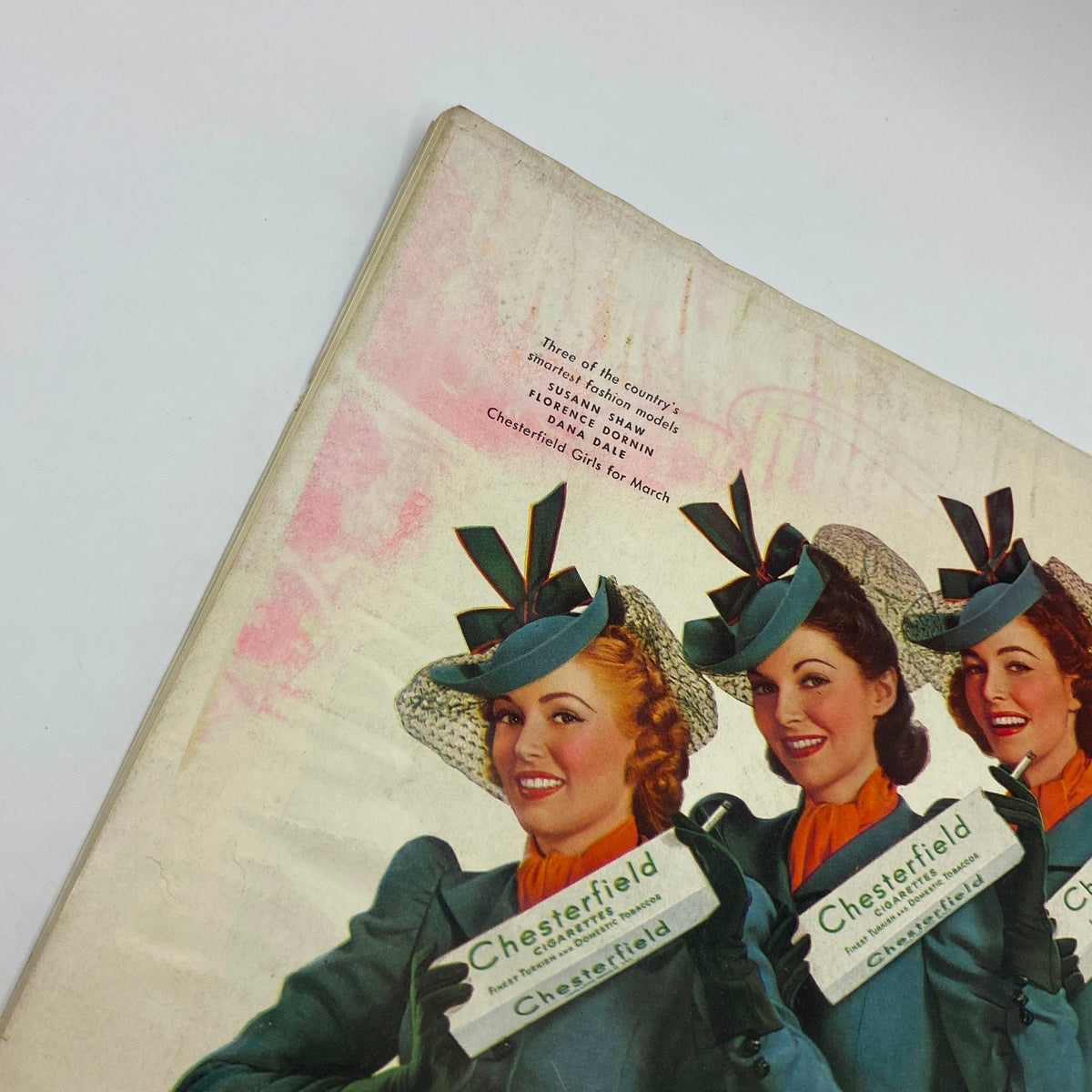 Close-up view of a vintage advertisement from The New Yorker March 2, 1940 featuring Chesterfield cigarette models with promotional packaging.