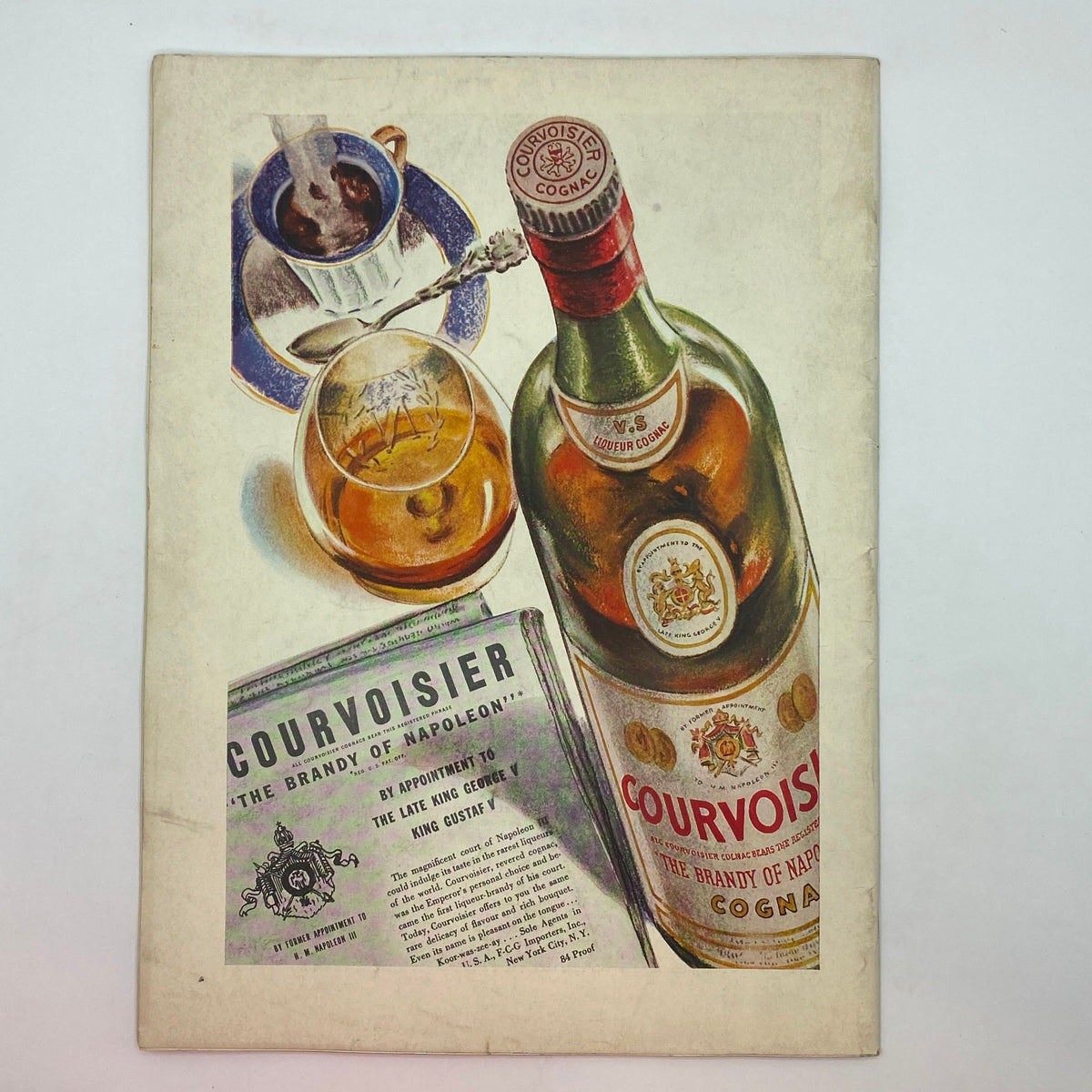 Artistic advertisement showcasing Courvoisier cognac with a glass and coffee cup, from The New Yorker Complete Magazine September 9, 1939 Constantin Alajalov Cover.