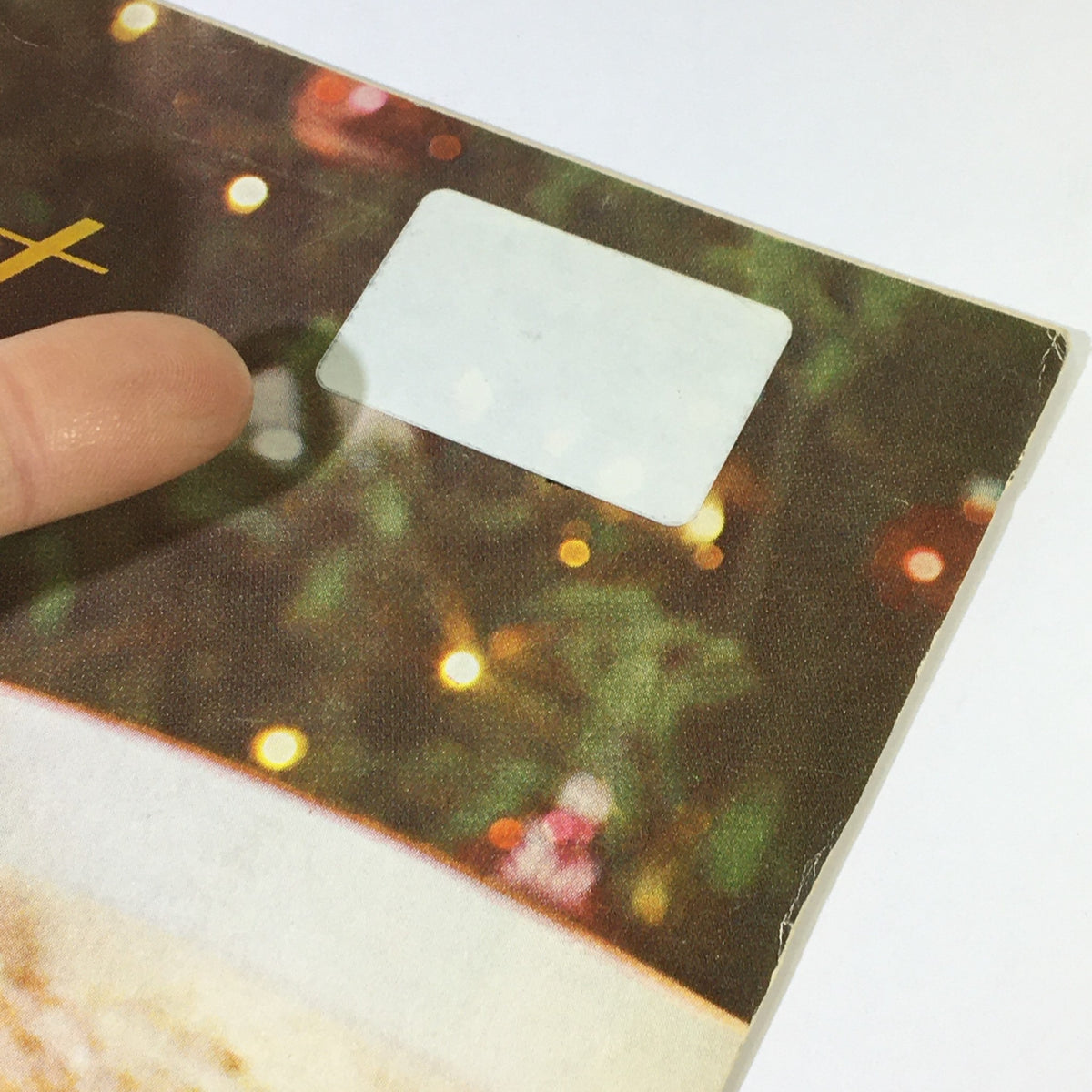 Close-up of VTG Gourmet The Magazine of Good Living December 1963 showcasing a minor defect with a blank sticker on the magazine cover.