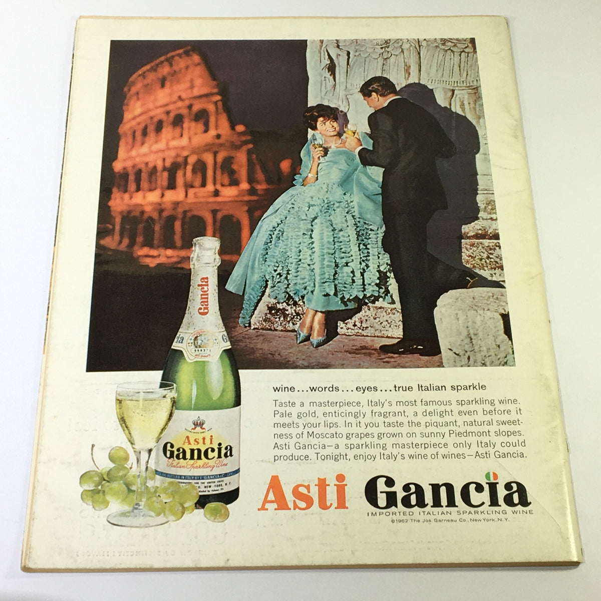 Cover of VTG Gourmet The Magazine of Good Living April 1964 featuring a vintage advertisement for Asti Gancia sparkling wine with a couple in elegant attire in front of the Colosseum.