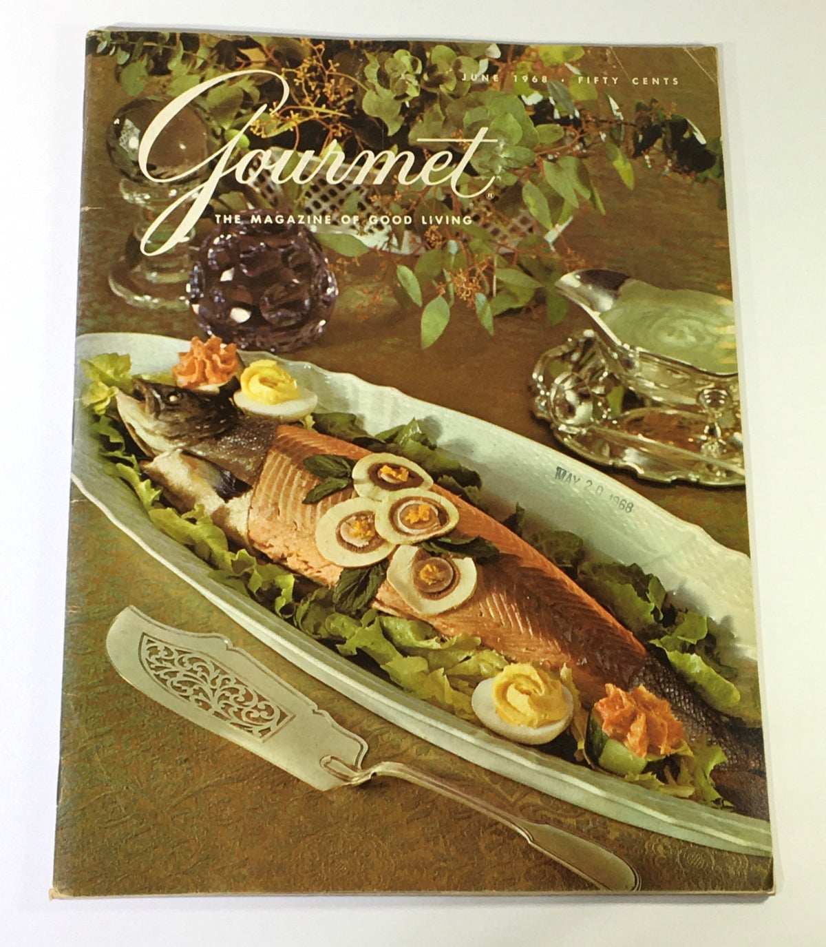 Cover of VTG Gourmet The Magazine of Good Living June 1968 featuring a beautifully arranged platter of salmon with garnish and a decorative knife, showcasing the culinary artistry of the Highlands.
