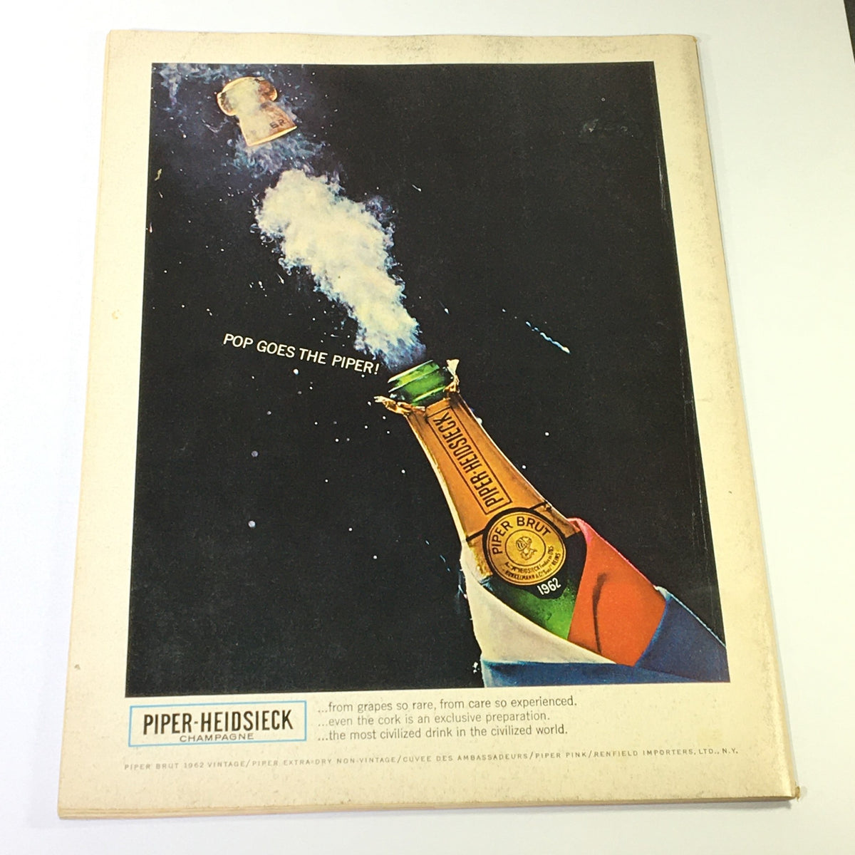 Back cover of VTG Gourmet The Magazine of Good Living June 1968 with an advertisement for Piper-Heidsieck champagne, featuring a playful graphic of a champagne bottle popping open.