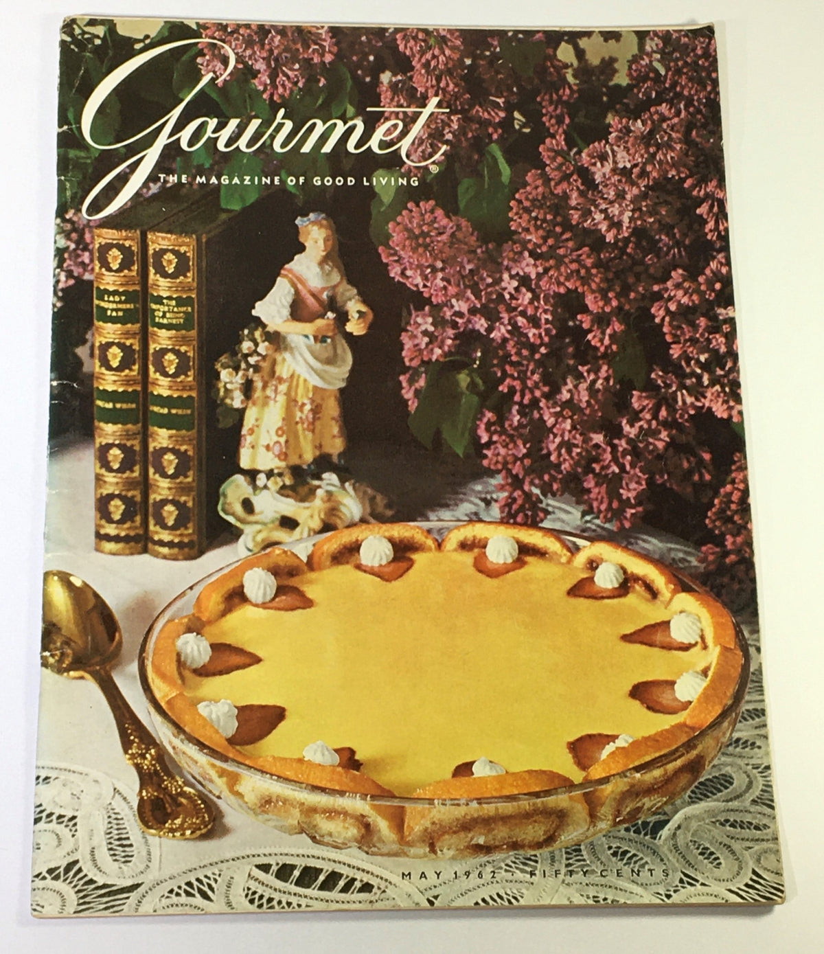 Cover of VTG Gourmet The Magazine of Good Living May 1962 featuring a delicious dessert, flowers, and decorative figurines.