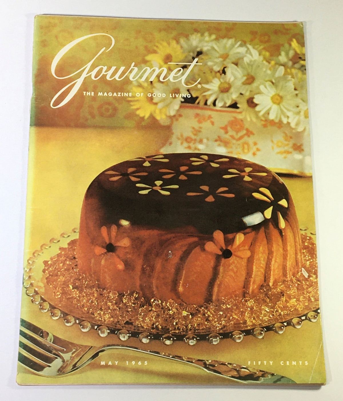 Cover of VTG Gourmet The Magazine of Good Living May 1965 featuring a colorful gelatin dessert on a decorative plate, showcasing the culinary trends of the 1960s.