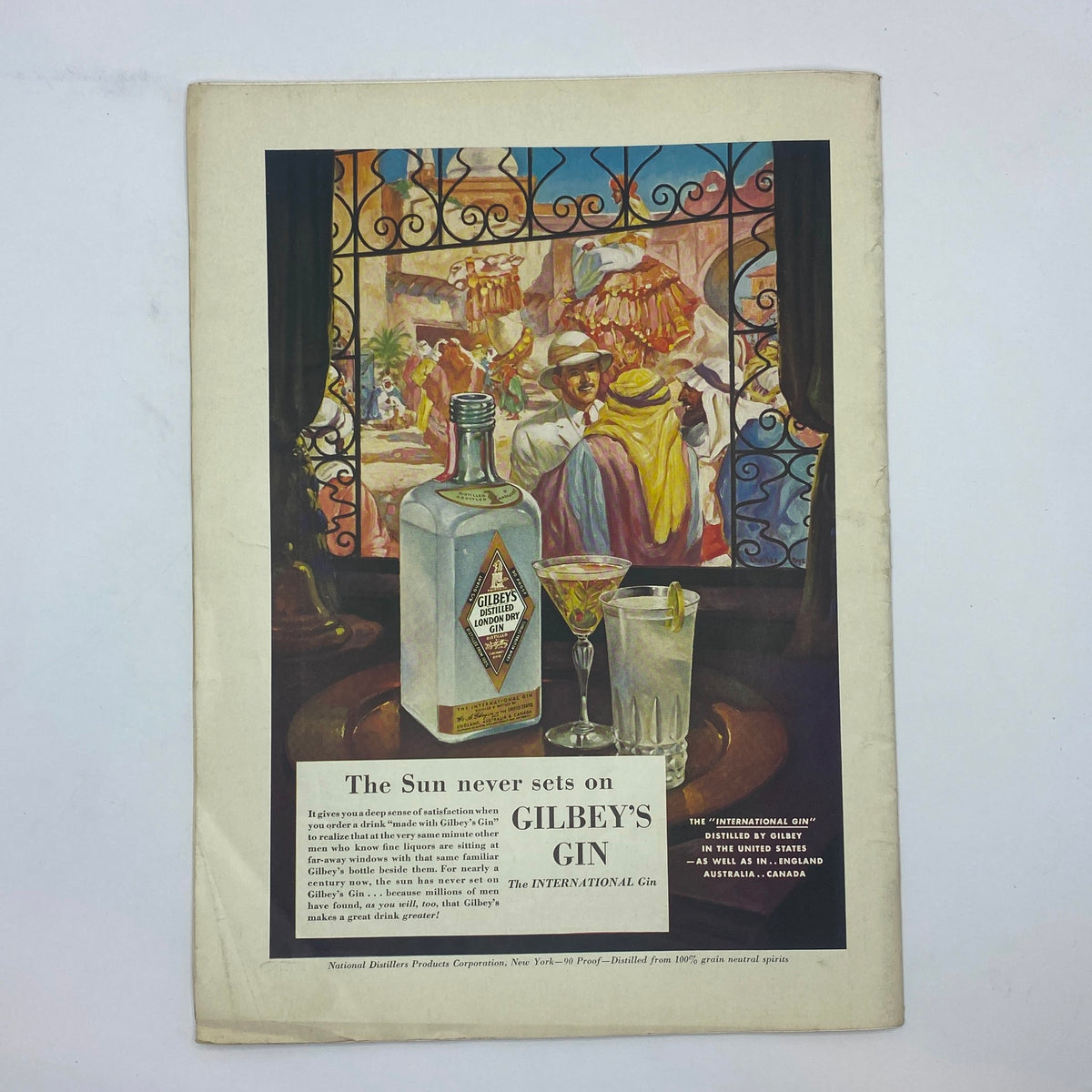 Interior page of The New Yorker Complete Magazine August 16, 1941, showcasing an advertisement for Gilbey's Gin. The colorful advertisement depicts a bottle of gin and cocktails, reflecting the drinking culture of the era.