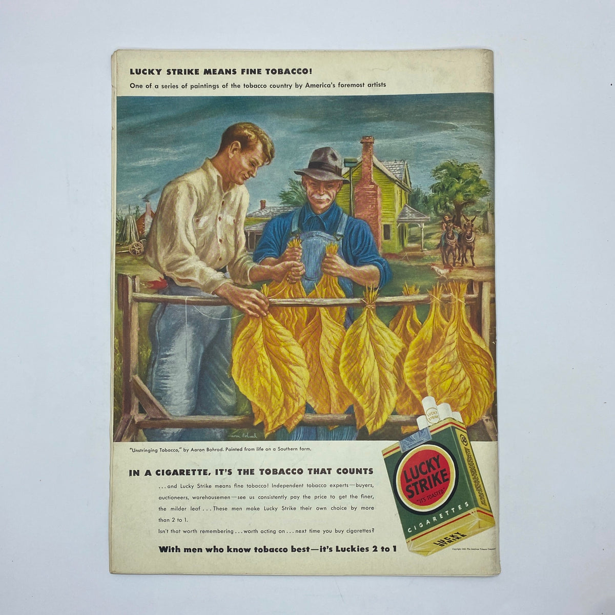 Lucky Strike tobacco advertisement from The New Yorker magazine, August 8, 1942, depicting two farmers discussing the quality of tobacco, emphasizing the craftsmanship and tradition behind Lucky Strike cigarettes.