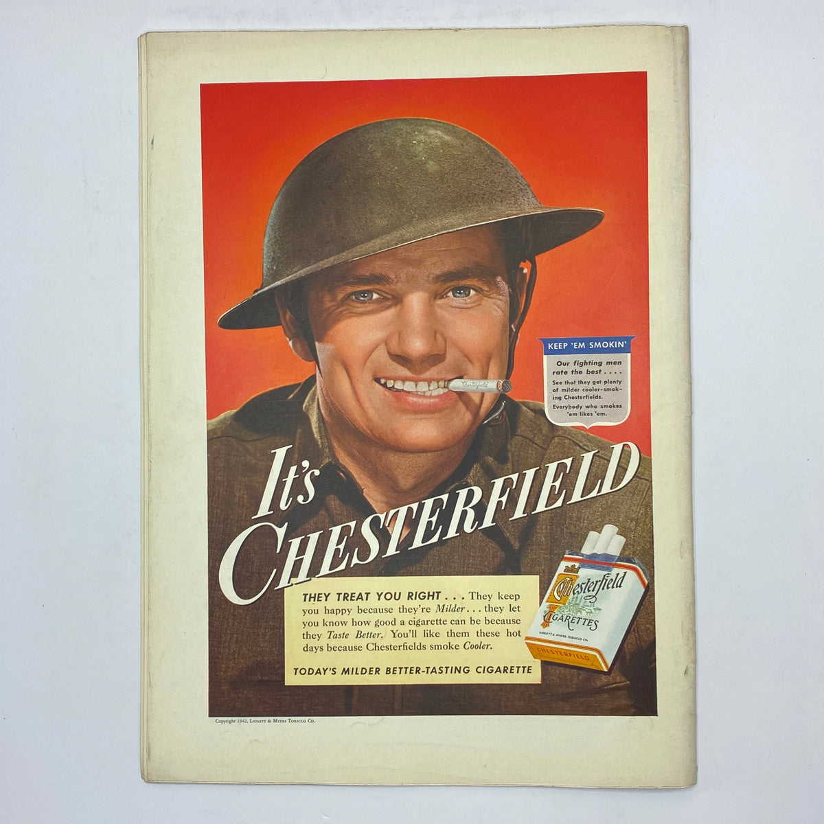 Chesterfield cigarette advertisement with a soldier smiling and promoting Chesterfield cigarettes in The New Yorker July 25, 1942.