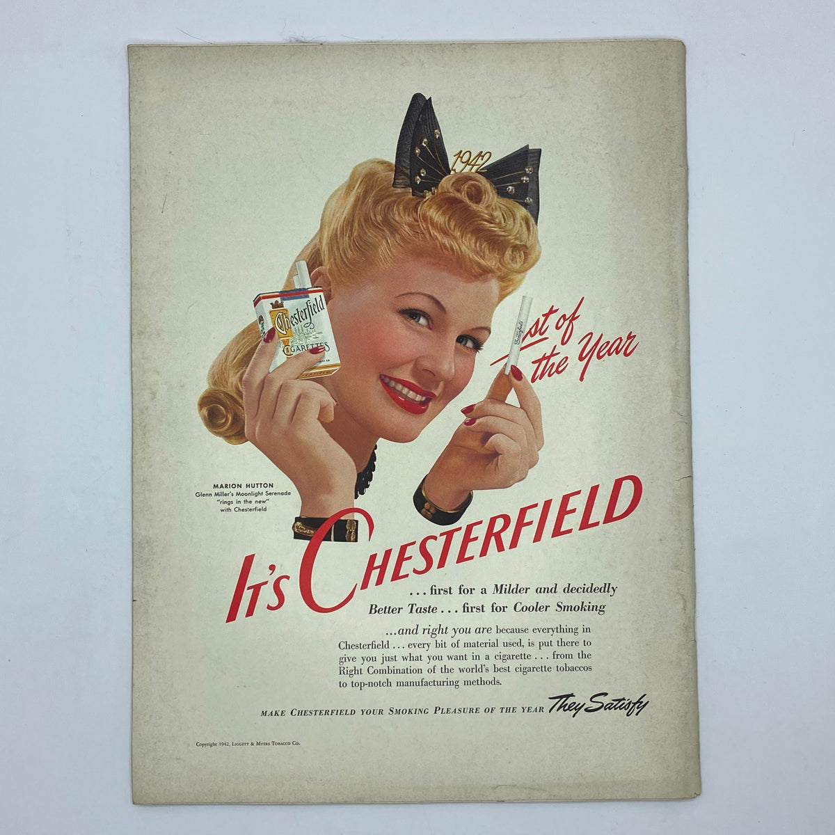Vintage Chesterfield advertisement page from The New Yorker Complete Magazine January 10, 1942 featuring a smiling woman promoting Chesterfield cigarettes.