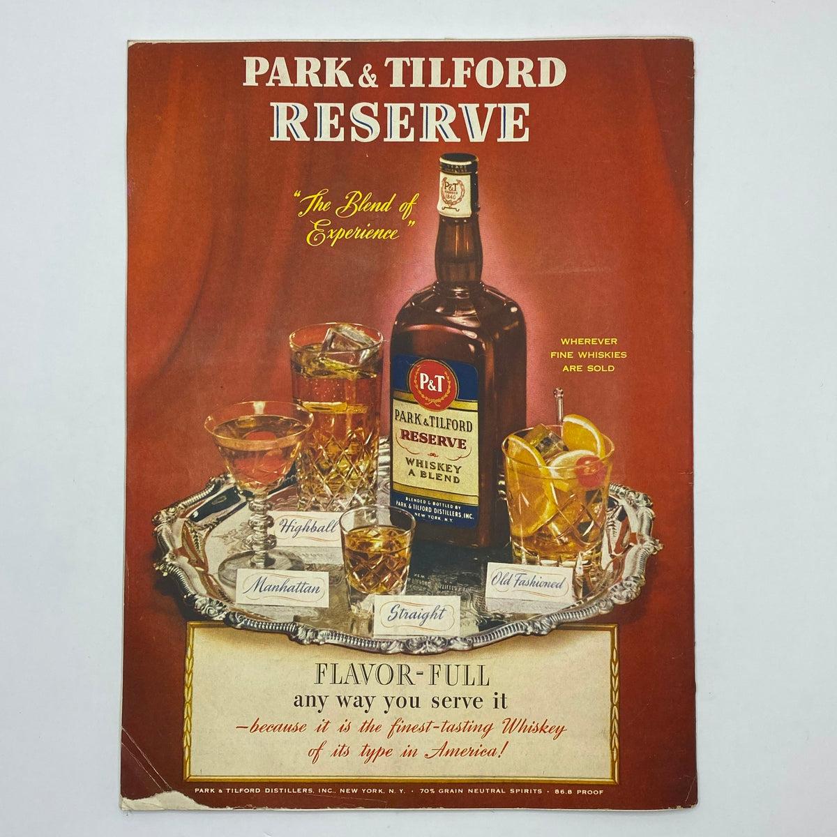 Vintage advertisement for Park & Tilford Reserve whiskey featuring a bottle and various cocktails including Highball, Manhattan, Straight, and Old Fashioned, showcasing the tagline 'The Blend of Experience'.