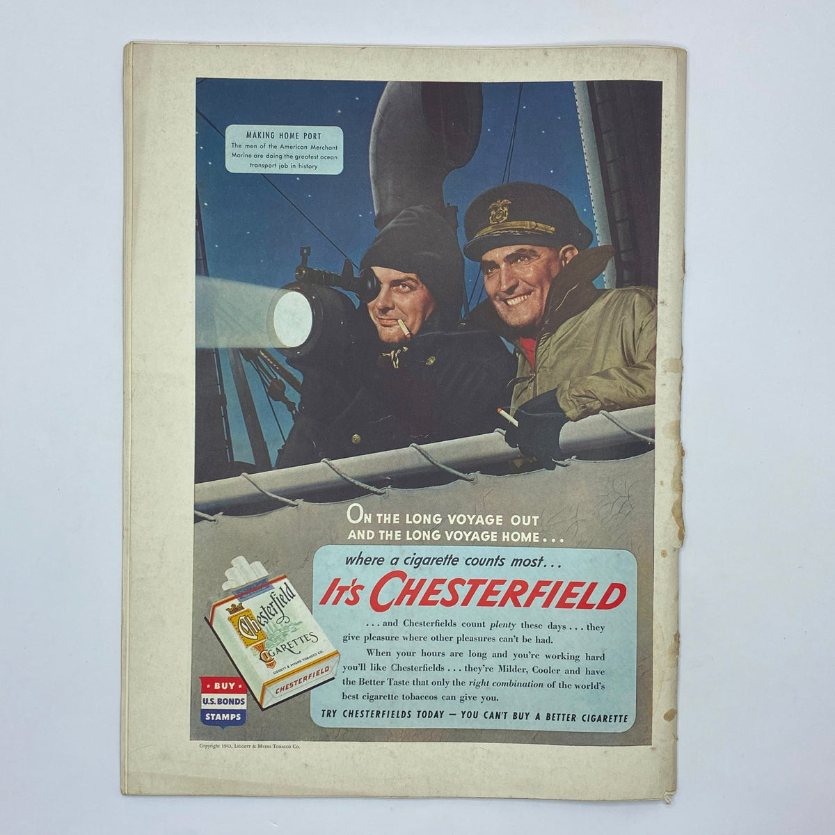 Vintage advertisement from The New Yorker magazine March 27, 1943, promoting Chesterfield cigarettes with an image of two sailors enjoying their time on the sea.