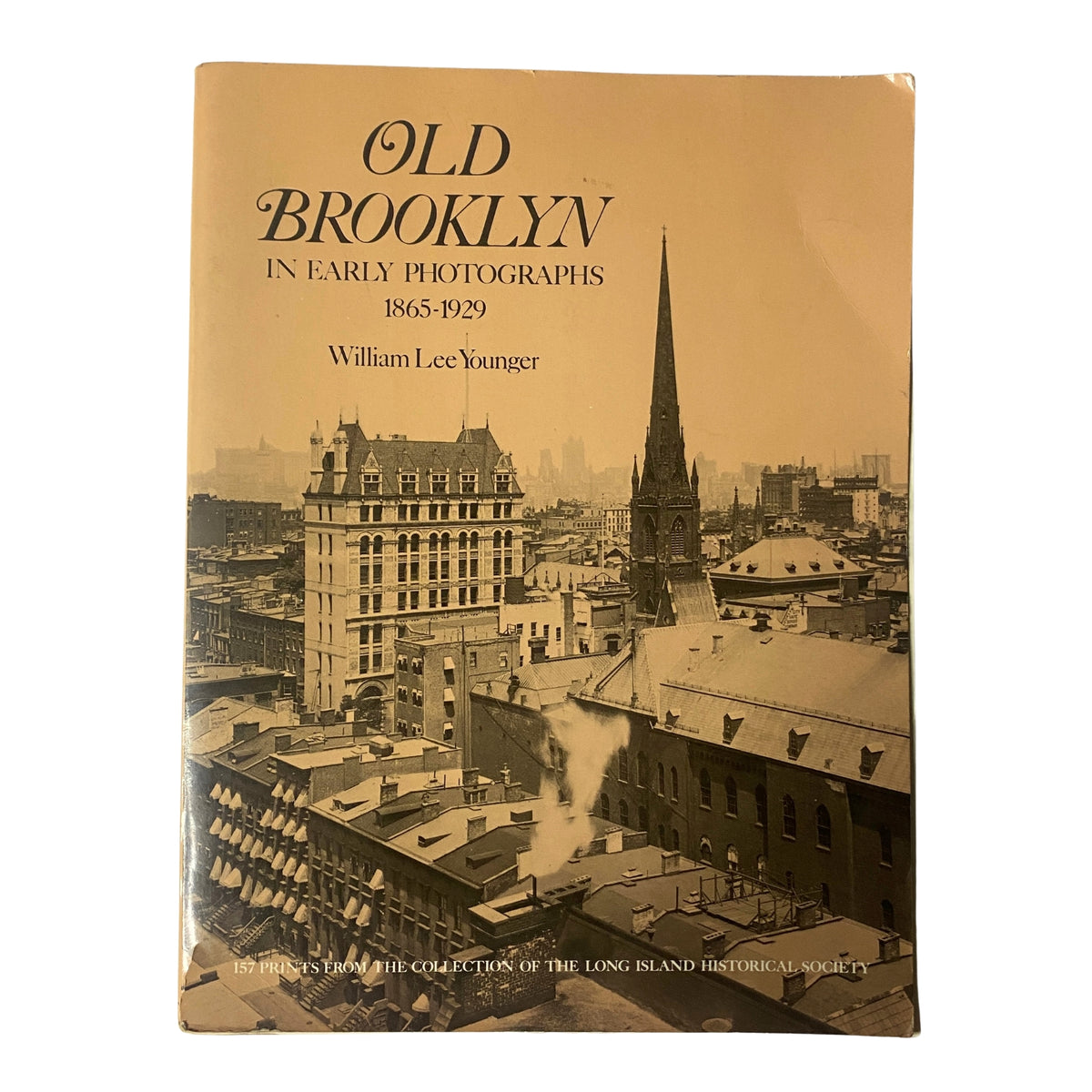 Cover of 'Old Brooklyn in Early Photographs 1865-1929' by William Lee Younger, showcasing historical architecture and skyline of Brooklyn.