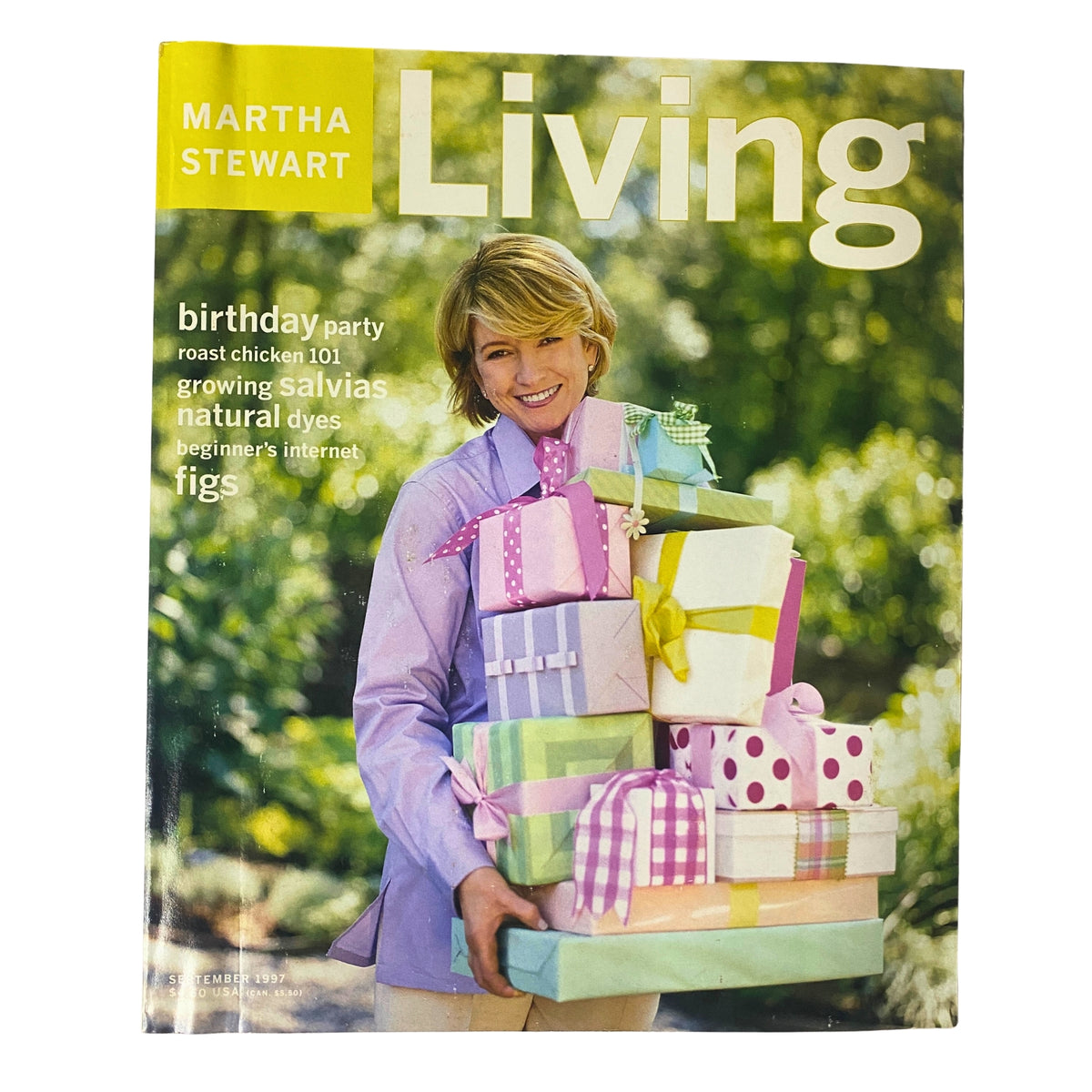 Cover of Martha Stewart Living Magazine September 1997 featuring a woman holding a stack of colorful birthday presents, promoting a birthday party theme.