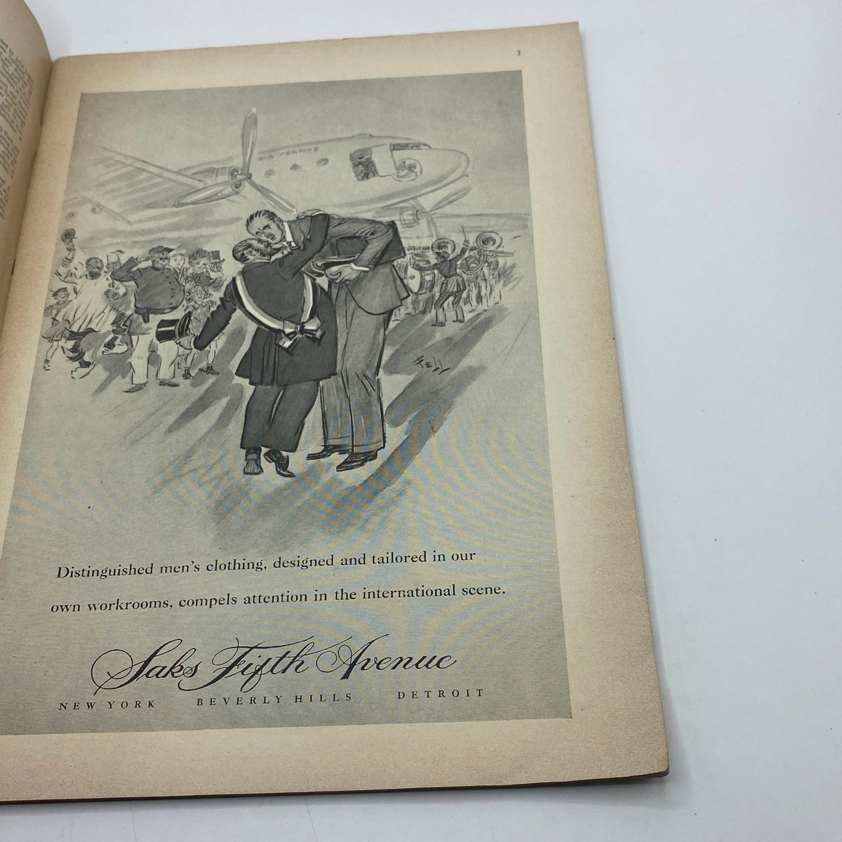 Advertisement page from The New Yorker Complete Magazine November 8, 1947 showing men’s clothing with an illustration of people welcoming an arrival.