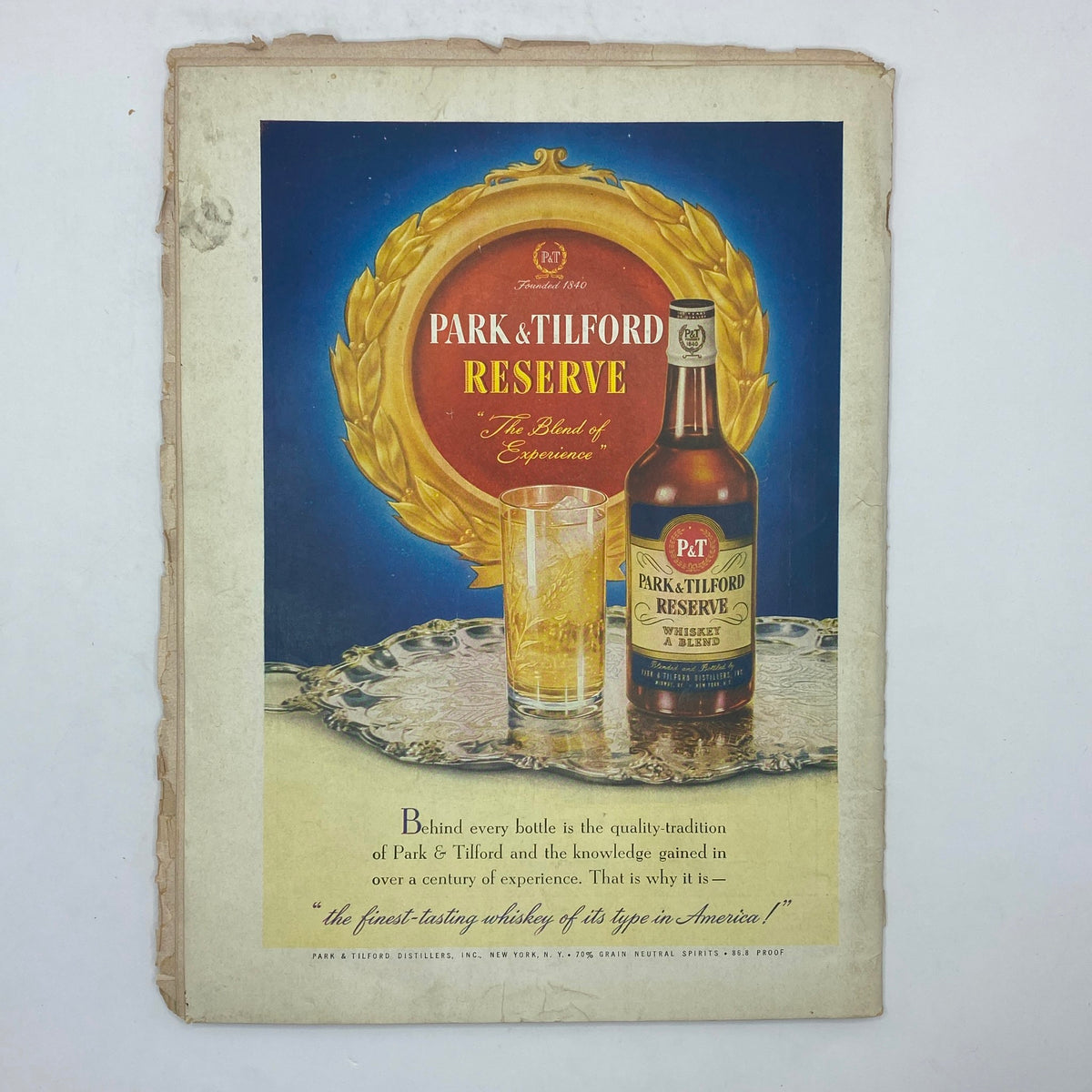 Advertisement for Park & Tilford Reserve whiskey in The New Yorker Complete Magazine December 13, 1947 Christina Malman Cover, showcasing the bottle and glassware.