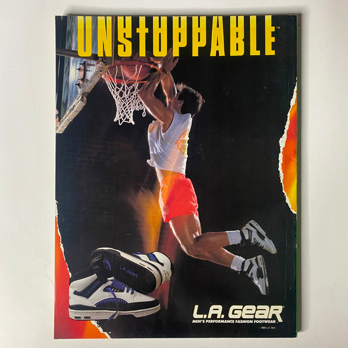 Advertisement page for L.A. Gear footwear, showcasing men's performance shoes with a basketball theme.