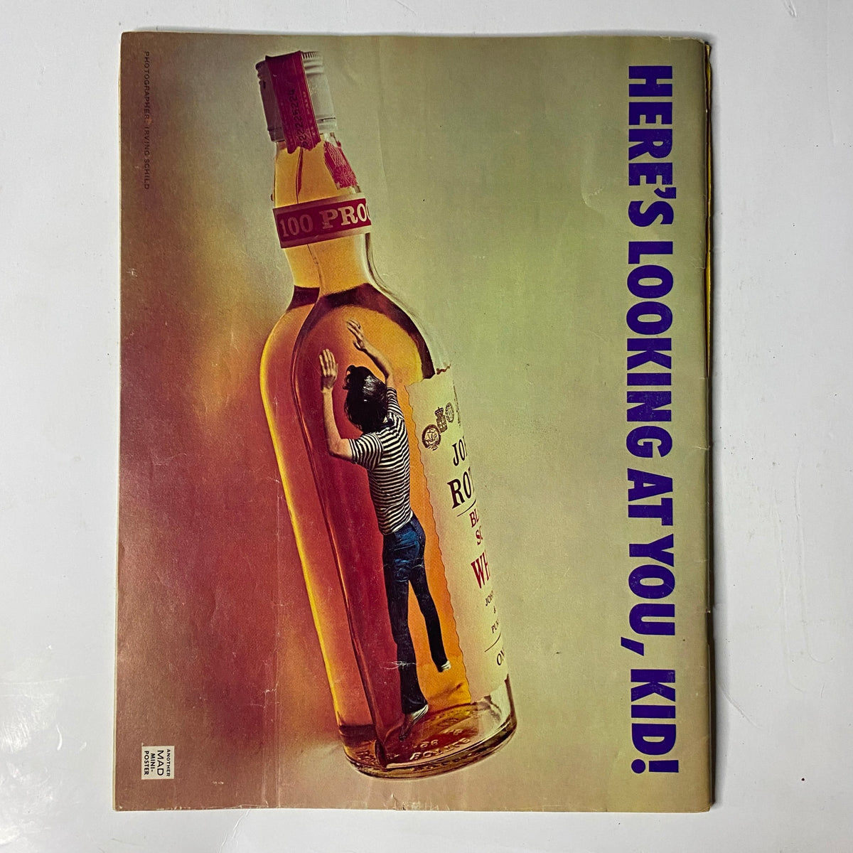 Back cover of Mad Magazine October 1975 No. 178 showcasing a humorous illustration of a bottle with a person inside, titled 'HERE'S LOOKING AT YOU, KID!'. 