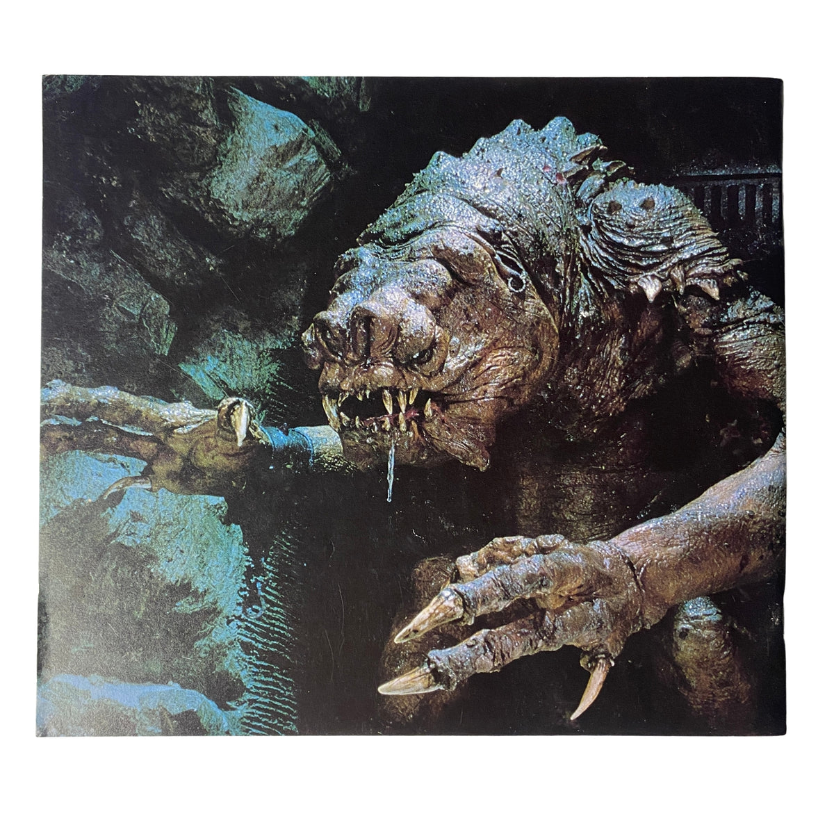Image of the Rancor monster from Return of the Jedi featured in Cinefex Magazine July 1983 No. 13, showcasing its menacing appearance with sharp claws and a fierce expression.