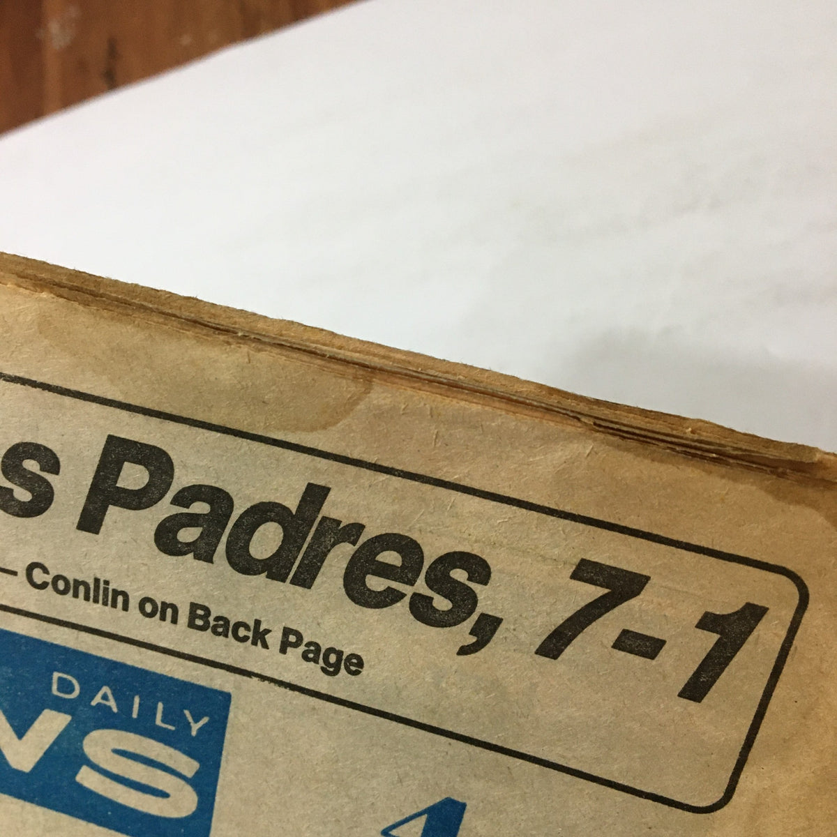 Close-up of the edge of the July 22, 1982 edition of the Philadelphia Daily News, featuring text related to the Philadelphia Phillies and San Diego Padres, with minor wear visible, under the title 'VTG Philadelphia Daily News July 22 1982 - Dave Garroway Kills Self / Newsstand'.
