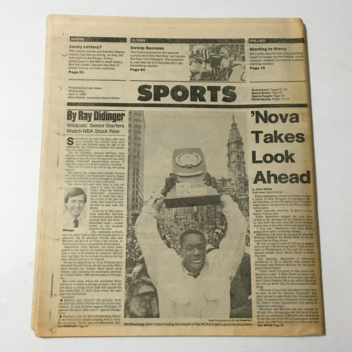 Inside page of the Philadelphia Daily News from April 3, 1985 showcasing sports news with a focus on Ed Pinckney holding the NCAA trophy. This page emphasizes the rise of basketball legends during the transformative 1980s.