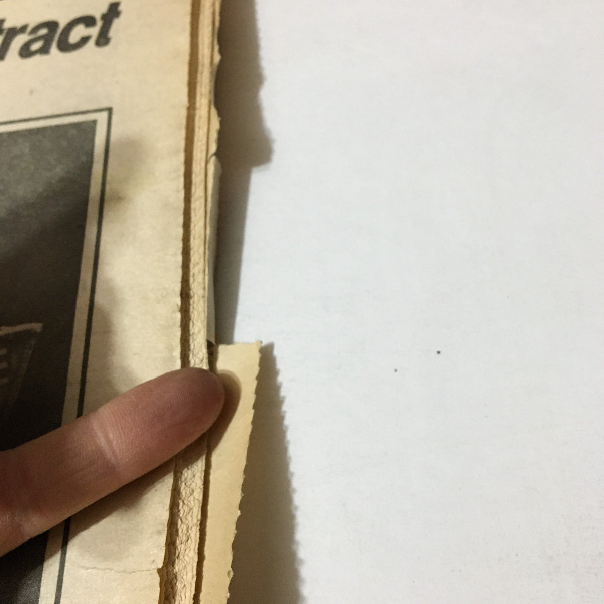 Close-up view of the edge of the VTG Philadelphia Daily News from September 1, 1982, with minor wear and tear visible on the paper. Relevant to the article about Kavan and Carl Moore's body.