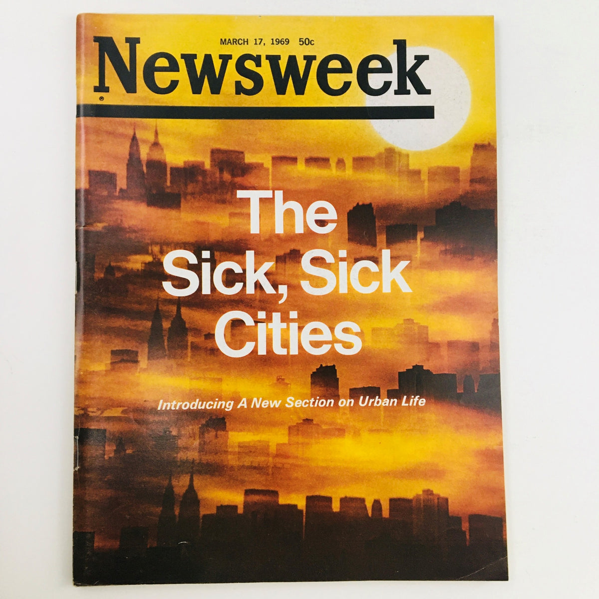 Newsweek Magazine cover from March 17, 1969, featuring the title 'The Sick, Sick Cities' and a backdrop of urban skyline with a dramatic sunset, highlighting issues of urban life.