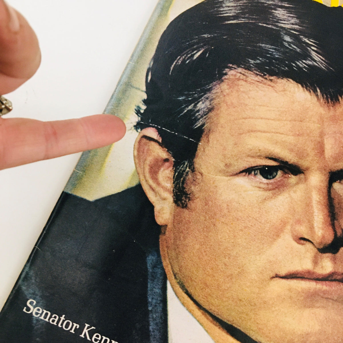 Close-up of the cover of Newsweek Magazine August 4, 1969, showing a detail of Senator Ted Kennedy with a finger pointing at the cover's condition.