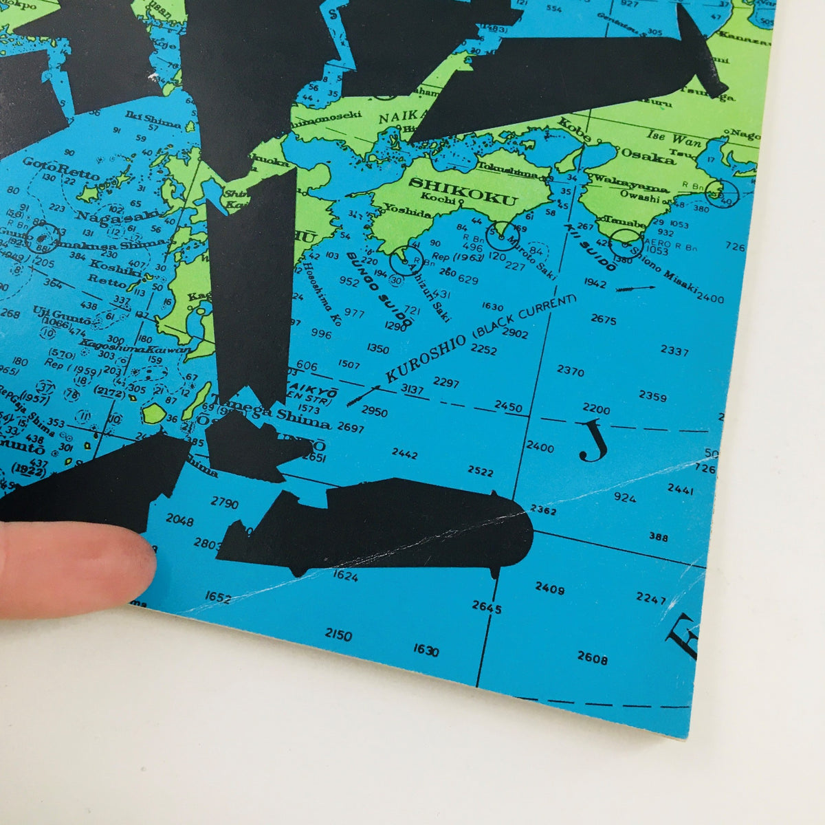 Close-up view of the cover from Newsweek Magazine April 28, 1969 highlighting the intricate details of the title 'Challenge From North Korea' against a vibrant map-themed background.