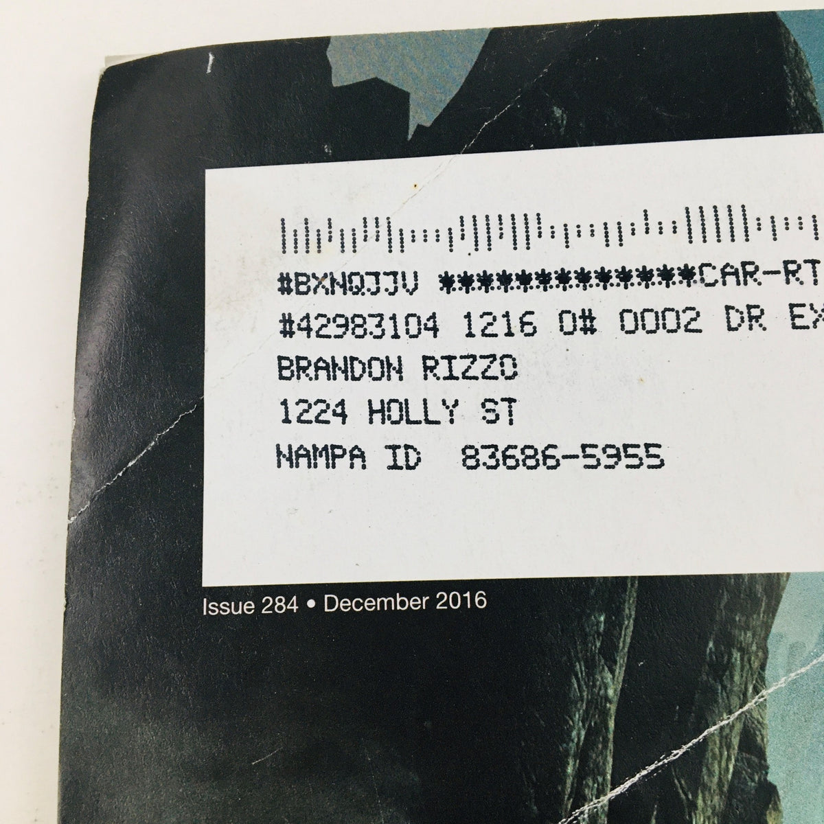 Detailed view of the back cover of Game Informer Magazine December 2016 Issue 284, featuring graphics from Mass Effect Andromeda and an address label.