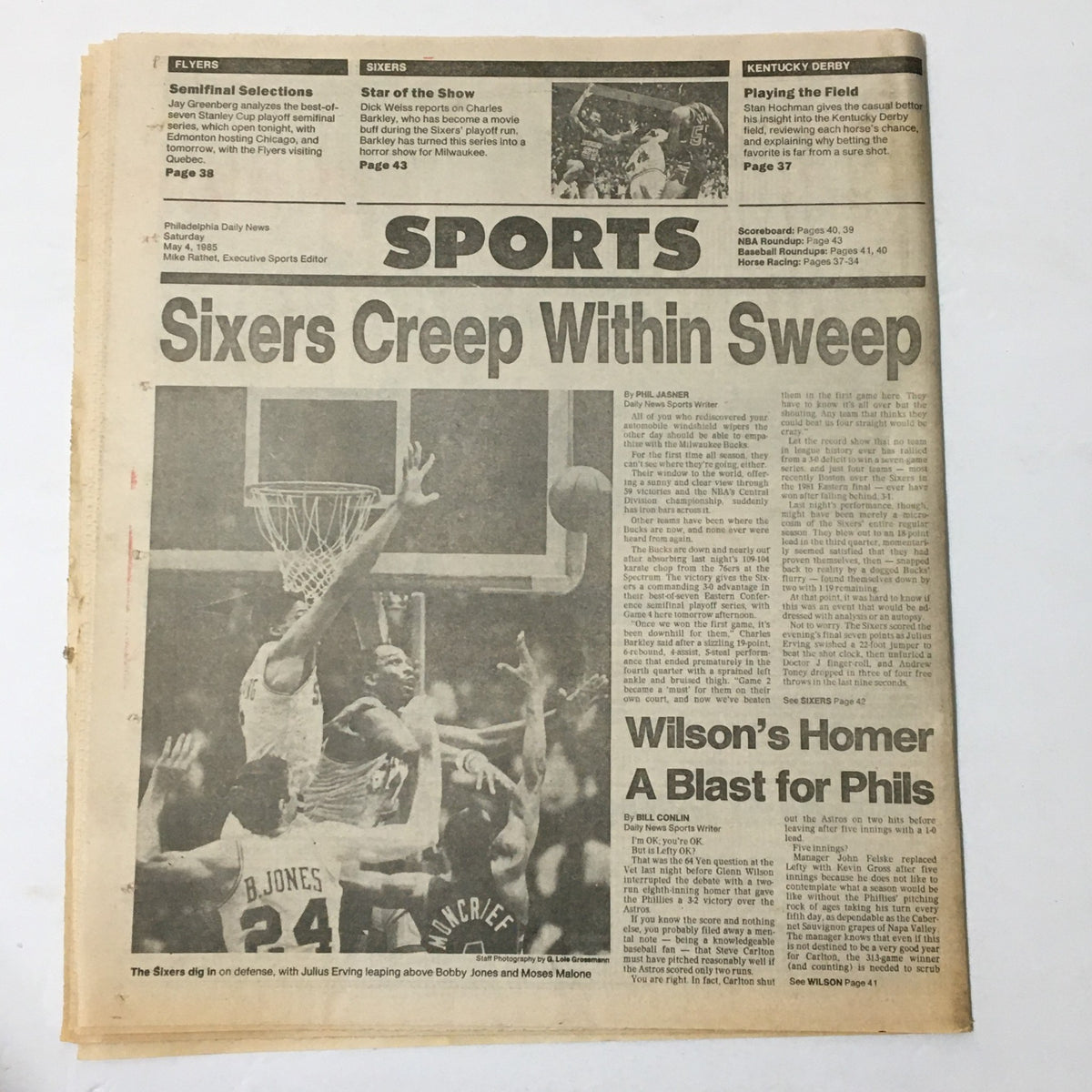 VTG Philadelphia Daily News, May 4, 1985, showcasing the Philadelphia Sixers' Julius Erving making a slam dunk, surrounded by defenders in a basketball game.